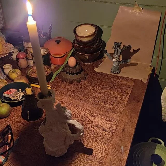 Shanley candles at work late at night in a friend's kitchen