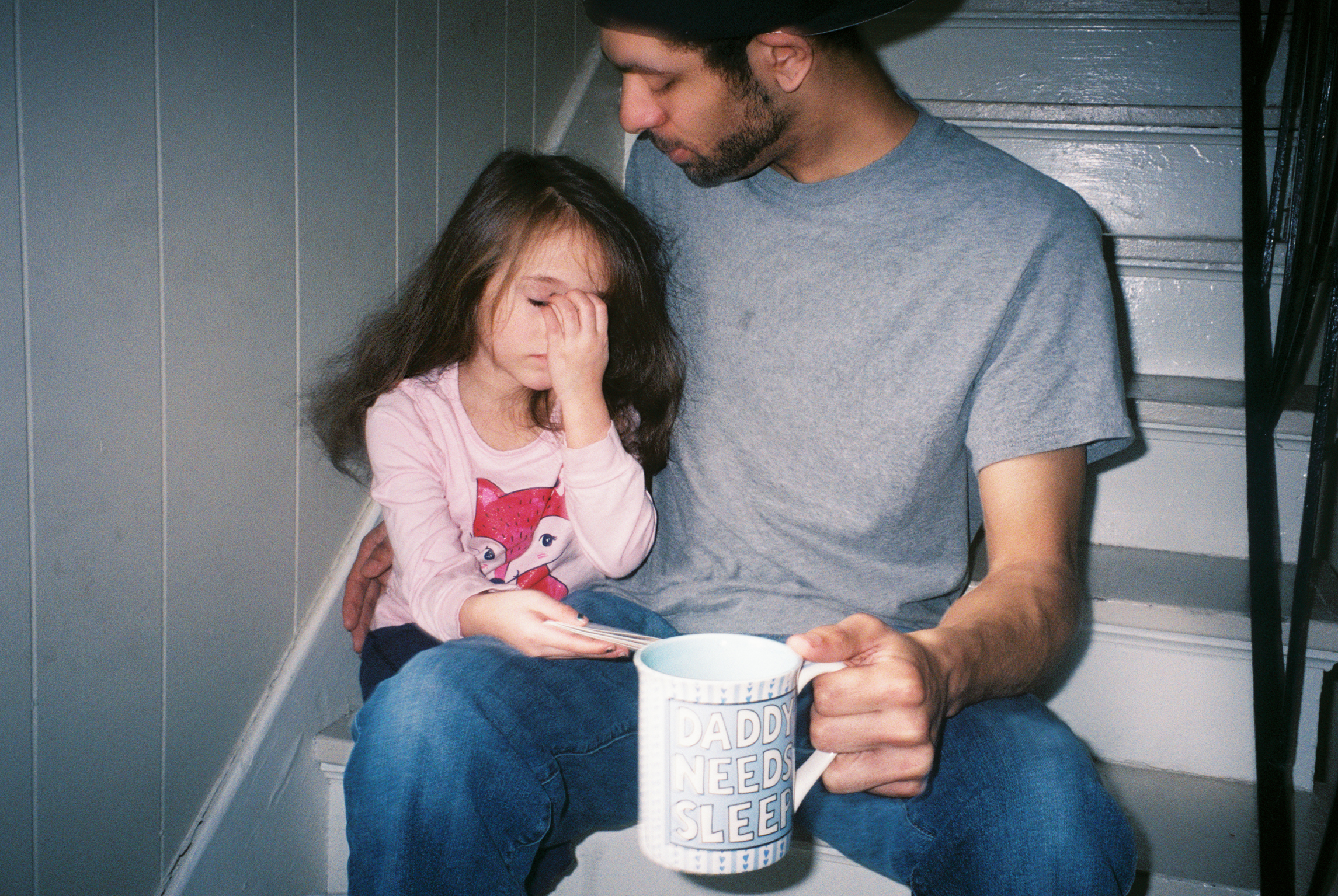 Tyler comforts his five-year-old daughter, Eisley, after awakening her from a nap at their home in Danville. Tyler works long hours at the Thyssen Krupp factory, where he makes camshafts for cars. He aspires to be a gym teacher and basketball coach.