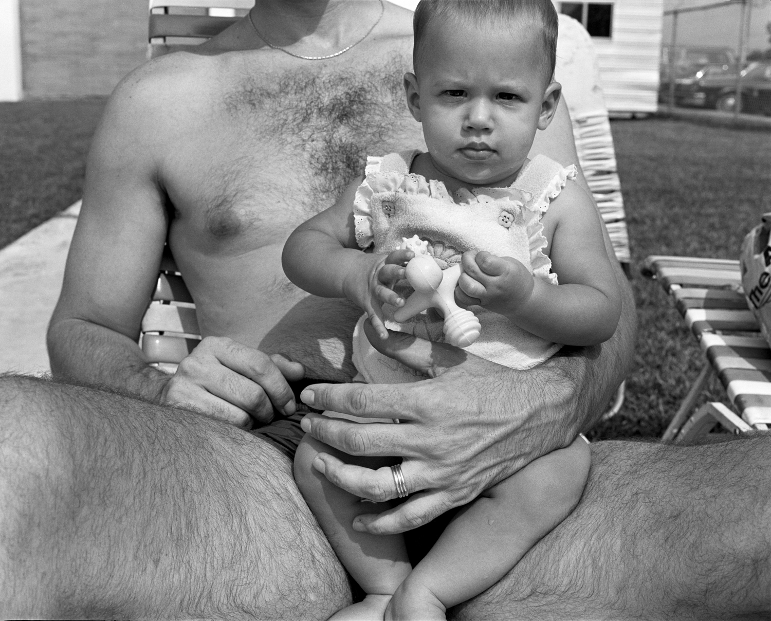 When I saw this baby on her dad’s lap like this, I rushed over and was sitting on the end of the chaise taking pictures before I finally looked up, laughed, and said I hoped it was okay!