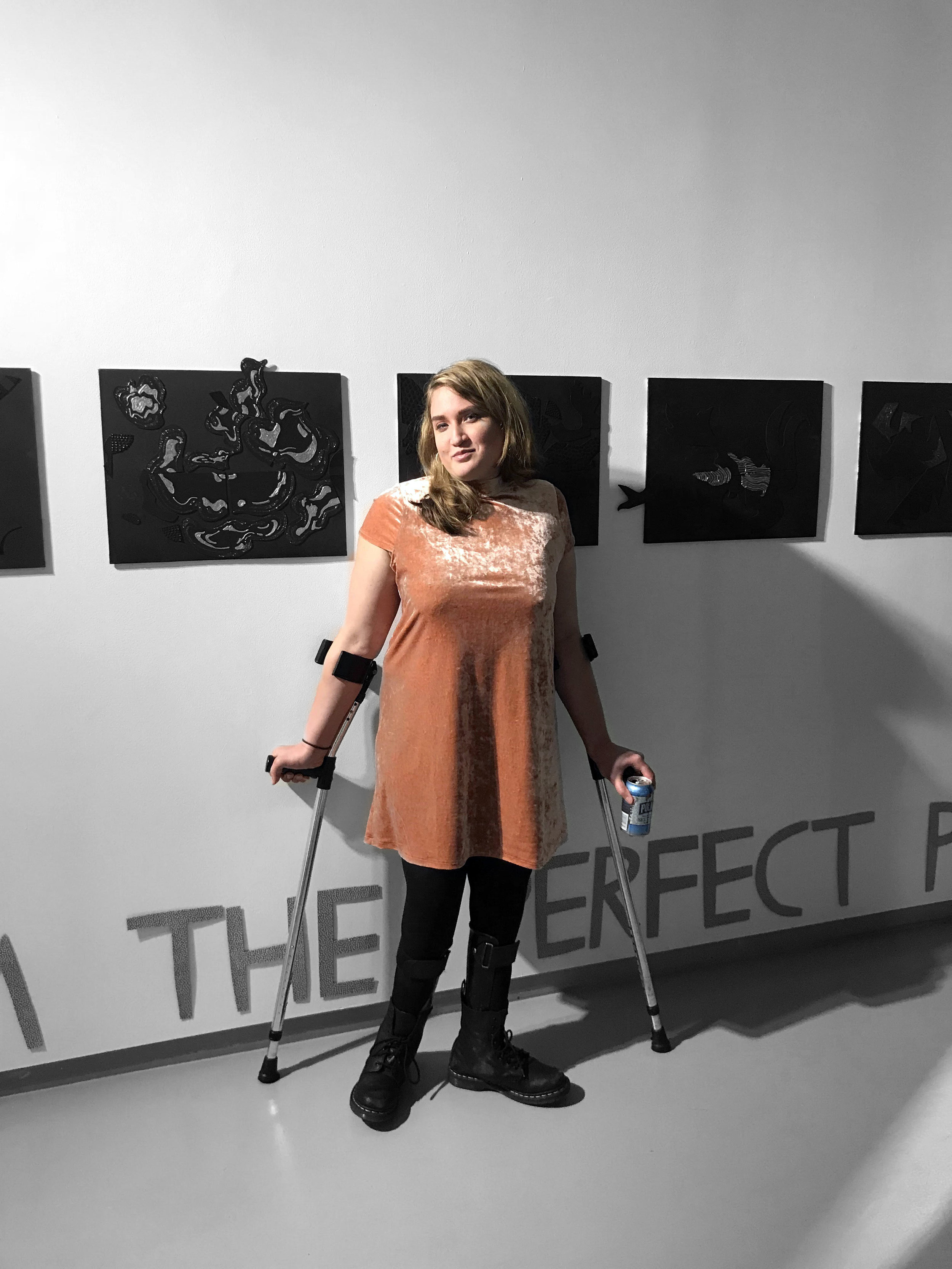  2018, Madison Zalopany in front of her tactile magnetic paintings at the Dedalus Foundation. Photo credit Adam Rose 