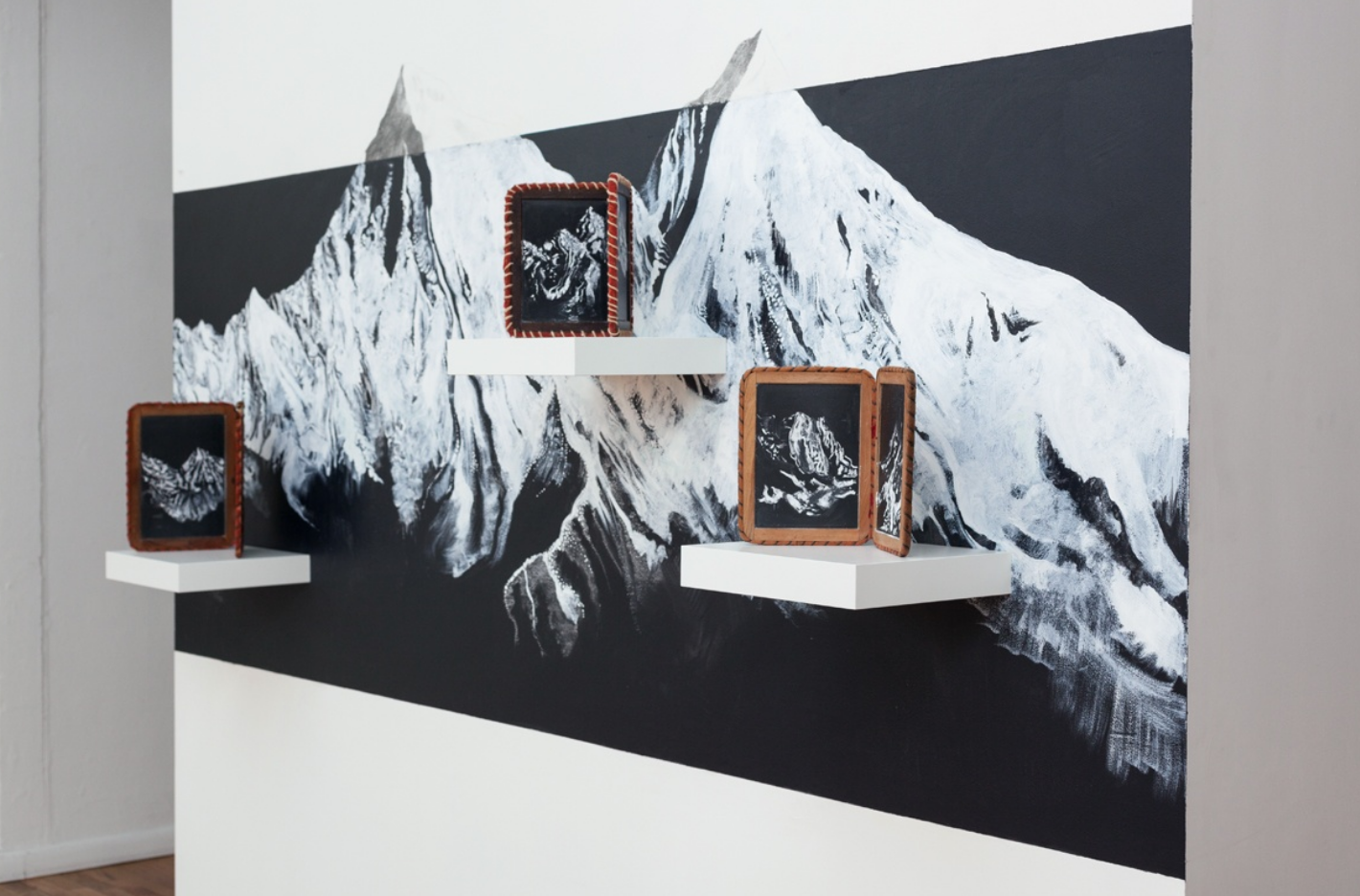 The Right Place ( views of mountain ranges I have spent time with), 2018, vintage school house slates, chalk, graphite, acrylic, shelves, dimensions variable