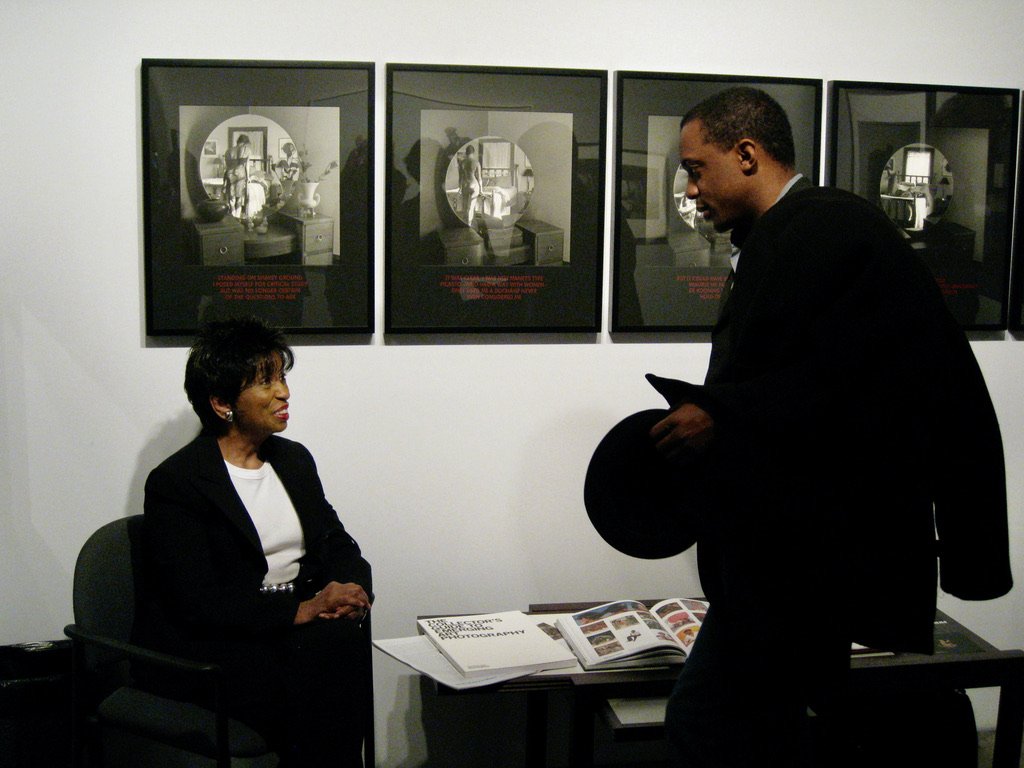  Collector Nancy Lane and Hank Willis Thomas in conversation, Charles Guice Contemporary’s booth at The AIPAD Photography Show New York, Park Avenue Armory, New York, 2009 
