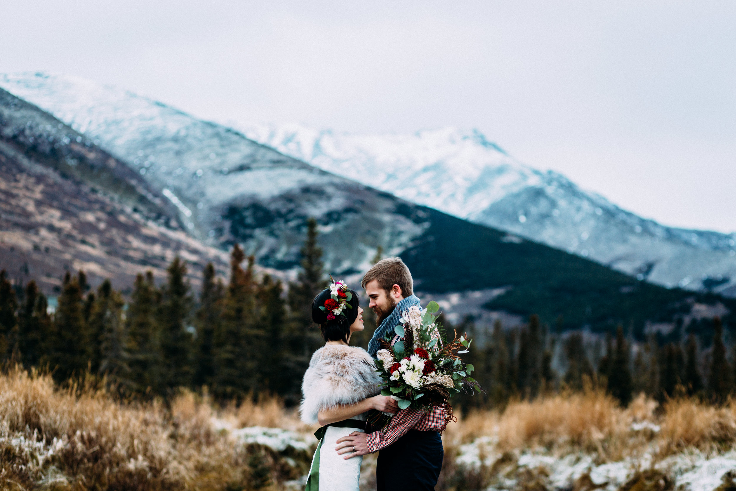 Couple eloping in Alaskan mountains