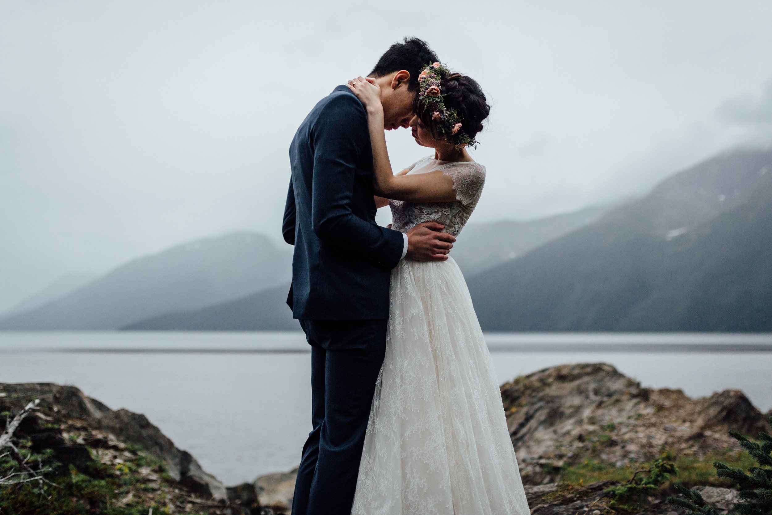 Bride and groom kissing in Alaska