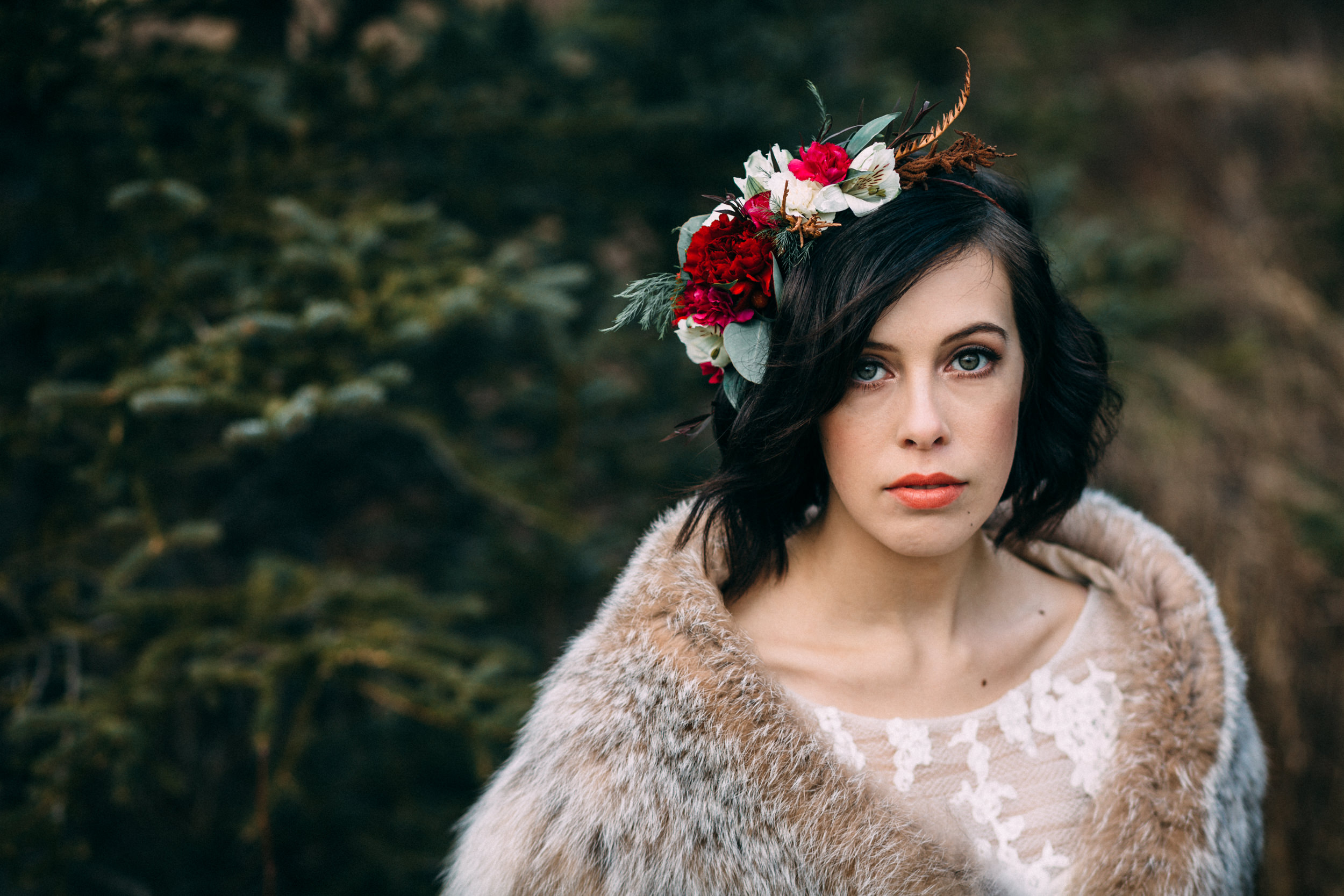 Bride with vibrant flower crown and lynx shawl