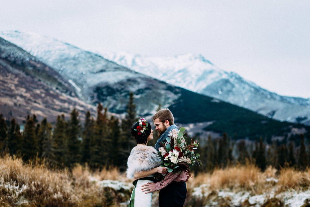 Bride and groom in front of Chugach Mountains