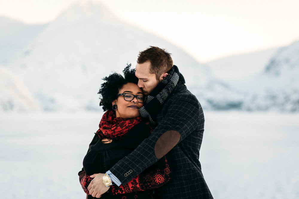 Couple staying warm during snowy Alaskan weather