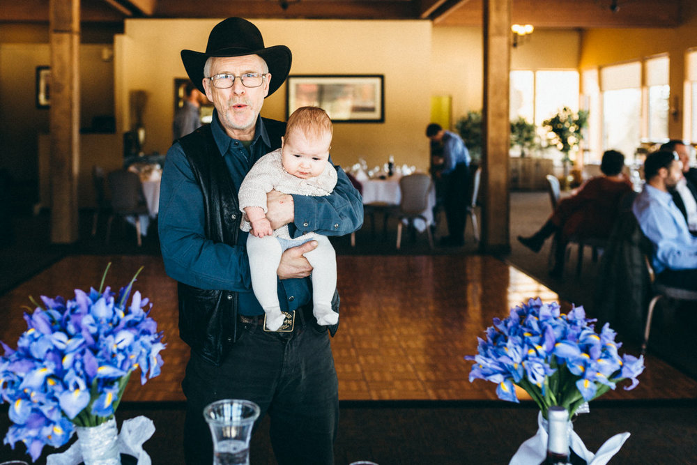 Wedding guest holding baby