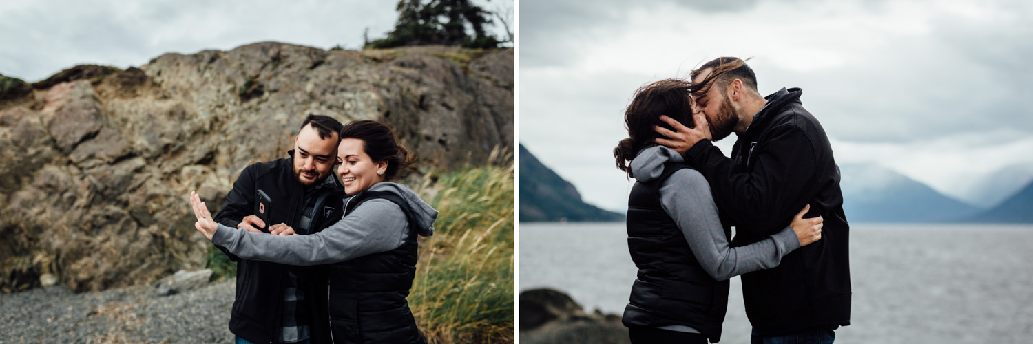 Couple taking a cell phone pic of engagement ring and kissing