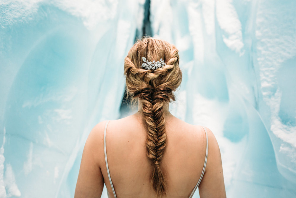 Bride with long braid in ice cave