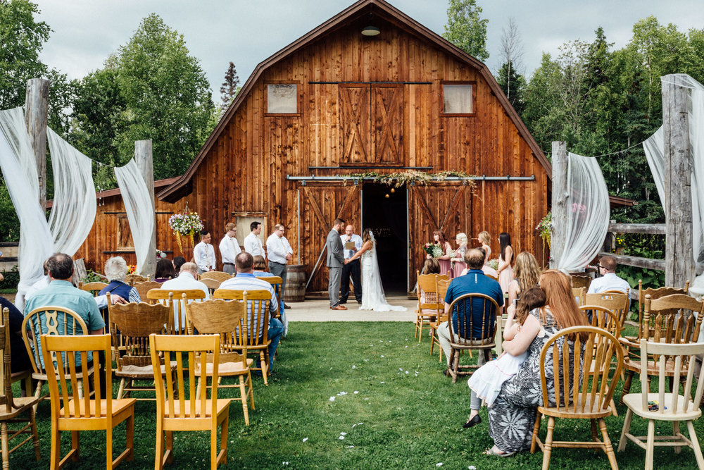Outdoor wedding ceremony on the lawn of Gloryview Farm in Wasilla, Alaska