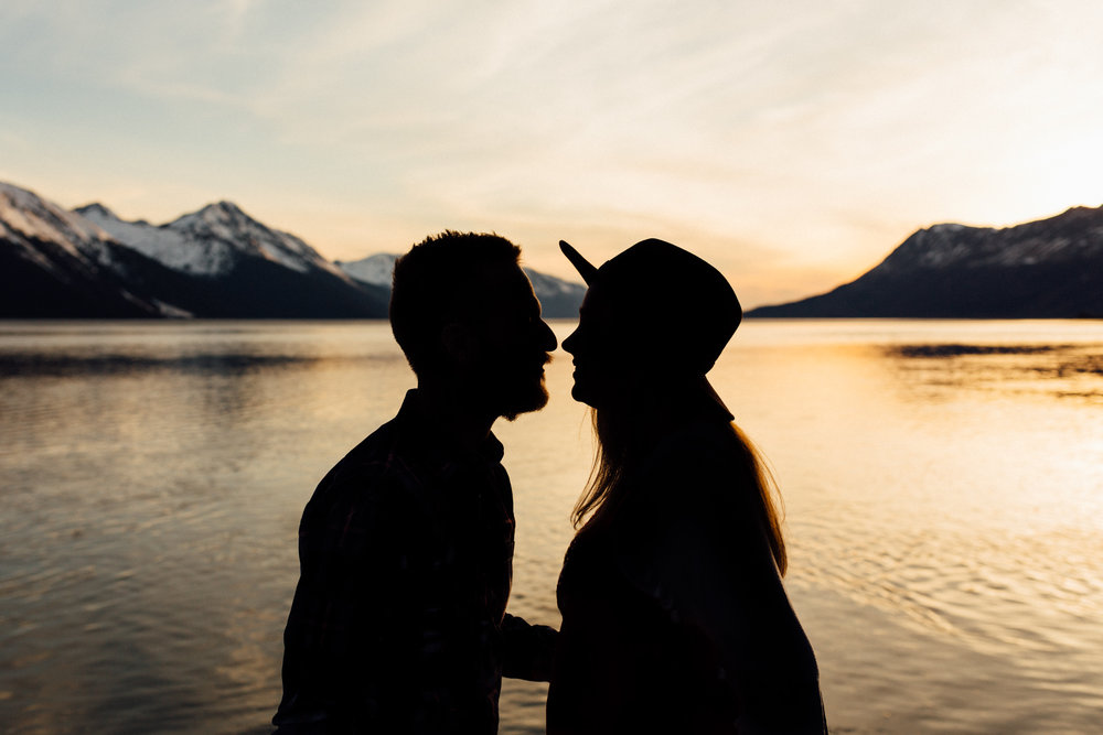 Silhouette of couple at sunset along Turnagain Arm
