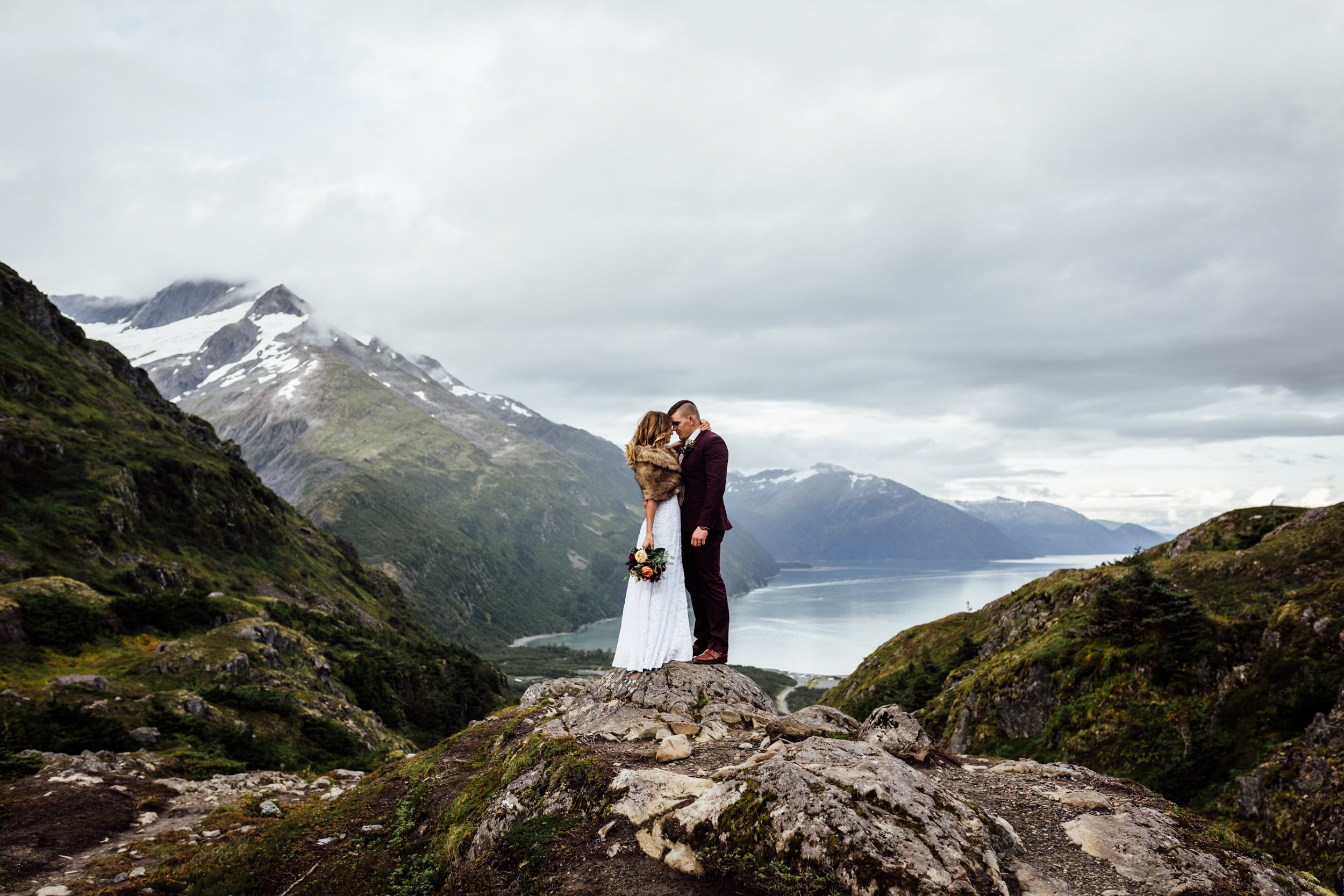 couple atop mountain peak