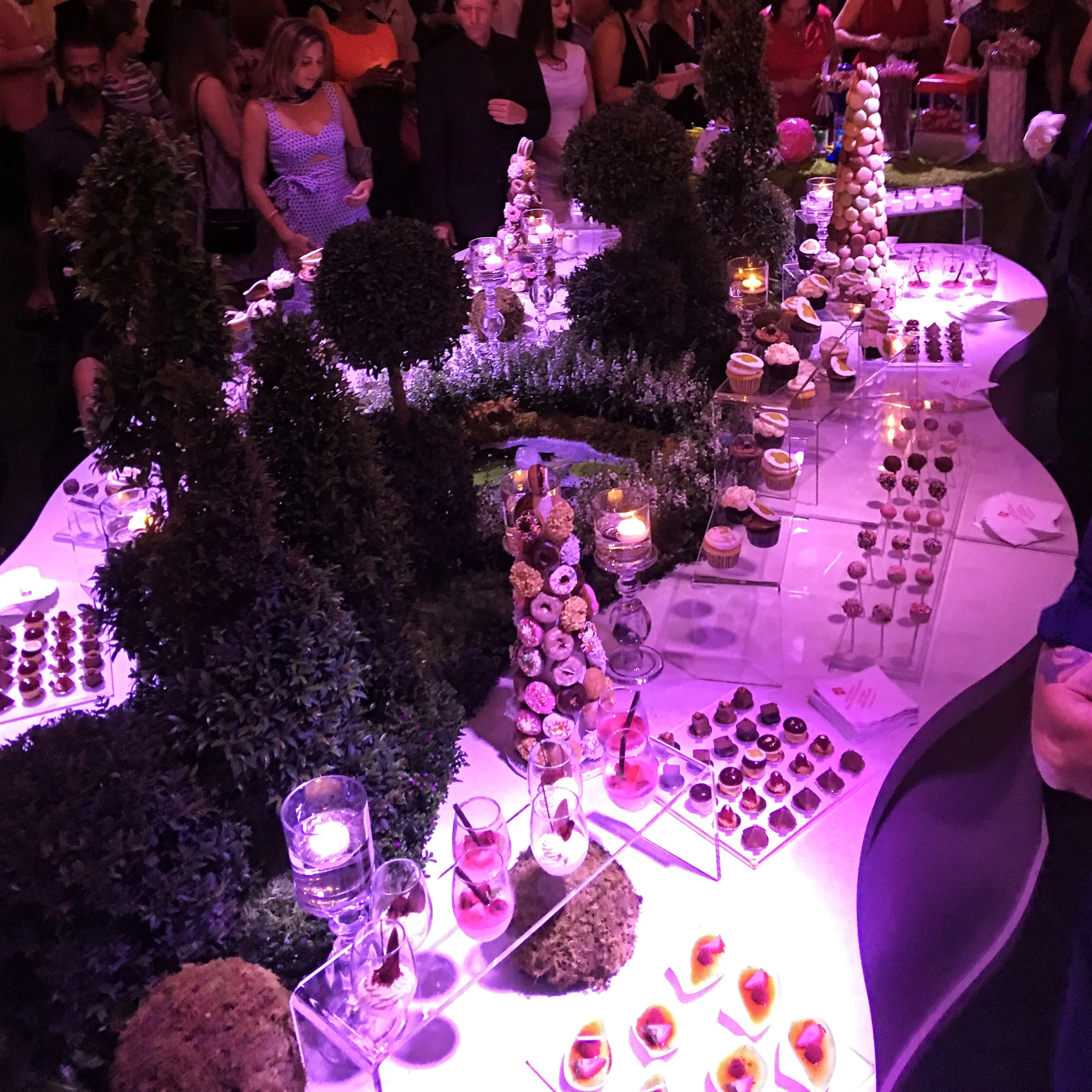 A deliciously tempting dessert station for a corporate event at Aqualina! Petit Fours: Mini Imported Valhrona Chocolates, Mini Fruit Tartlets, Espresso Parfaits, Assorted Macaroons, Crunch Praline Tower with Hazelnut Décor and Raspberry Mascarpone Fondants to name a few!