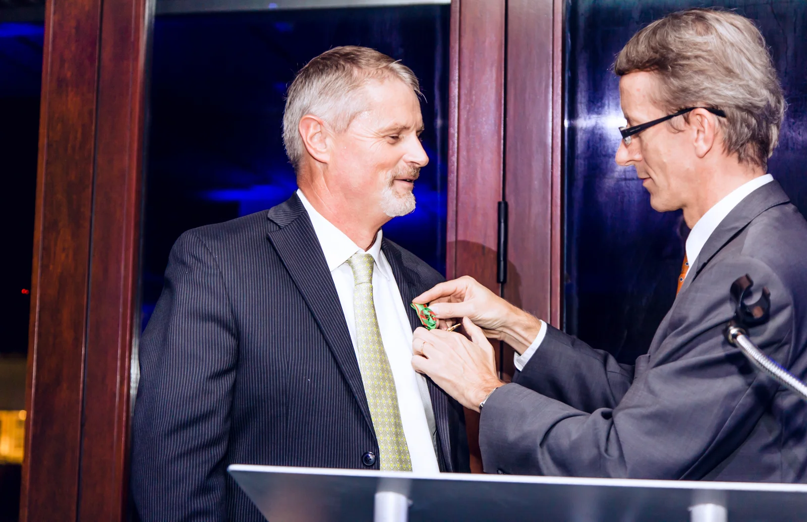 Thierry Isambert receiving the Ordre Du Mérite Agricole award from Consul General, Philippe Letrilliart at Palm Court Event Space in the Miami Design District