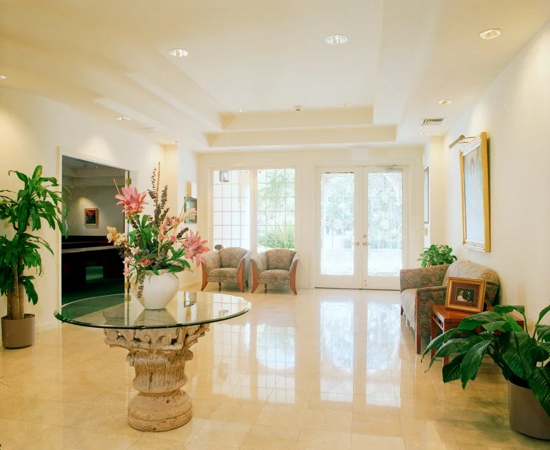 The leaded glass doors open into a gleaming marble lobby, a graceful staircase and a spacious 3,500 square foot ballroom with balconies.