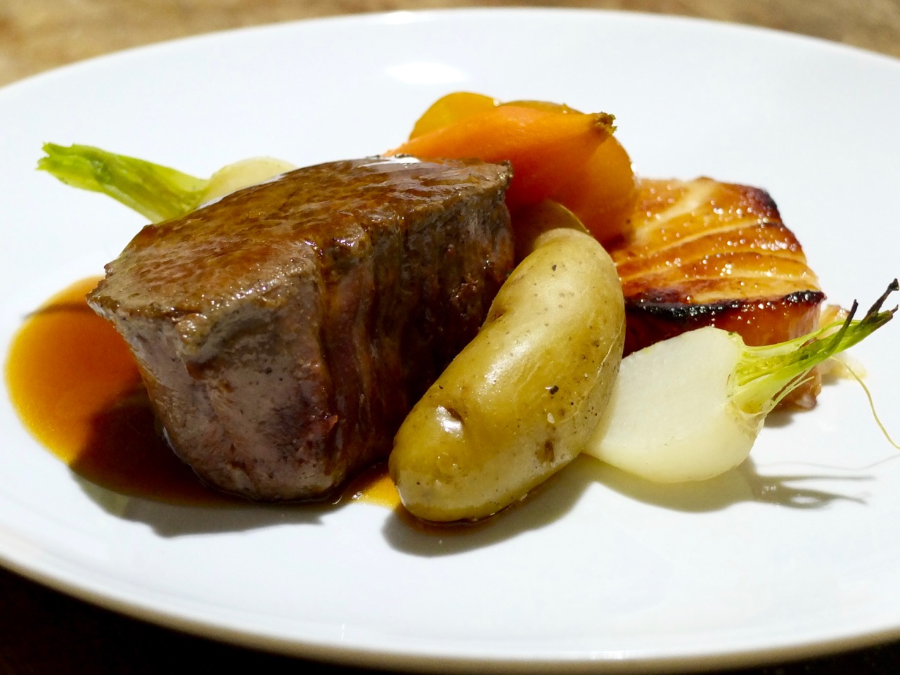 Filet Mignon with Truffle Wafu & Roasted Fingerling + Braised Chilean Sea Bass with Yuzu & Kumquat Confit