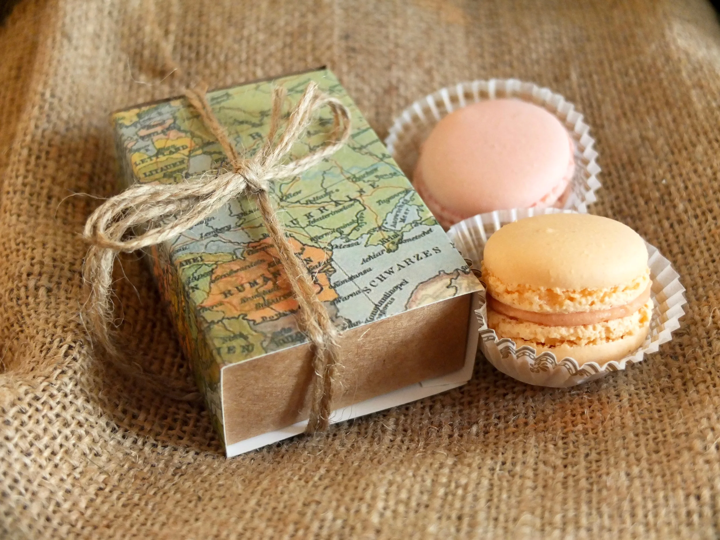 Each place setting included an adorable macaroon gift box wrapped in vintage-style maps.