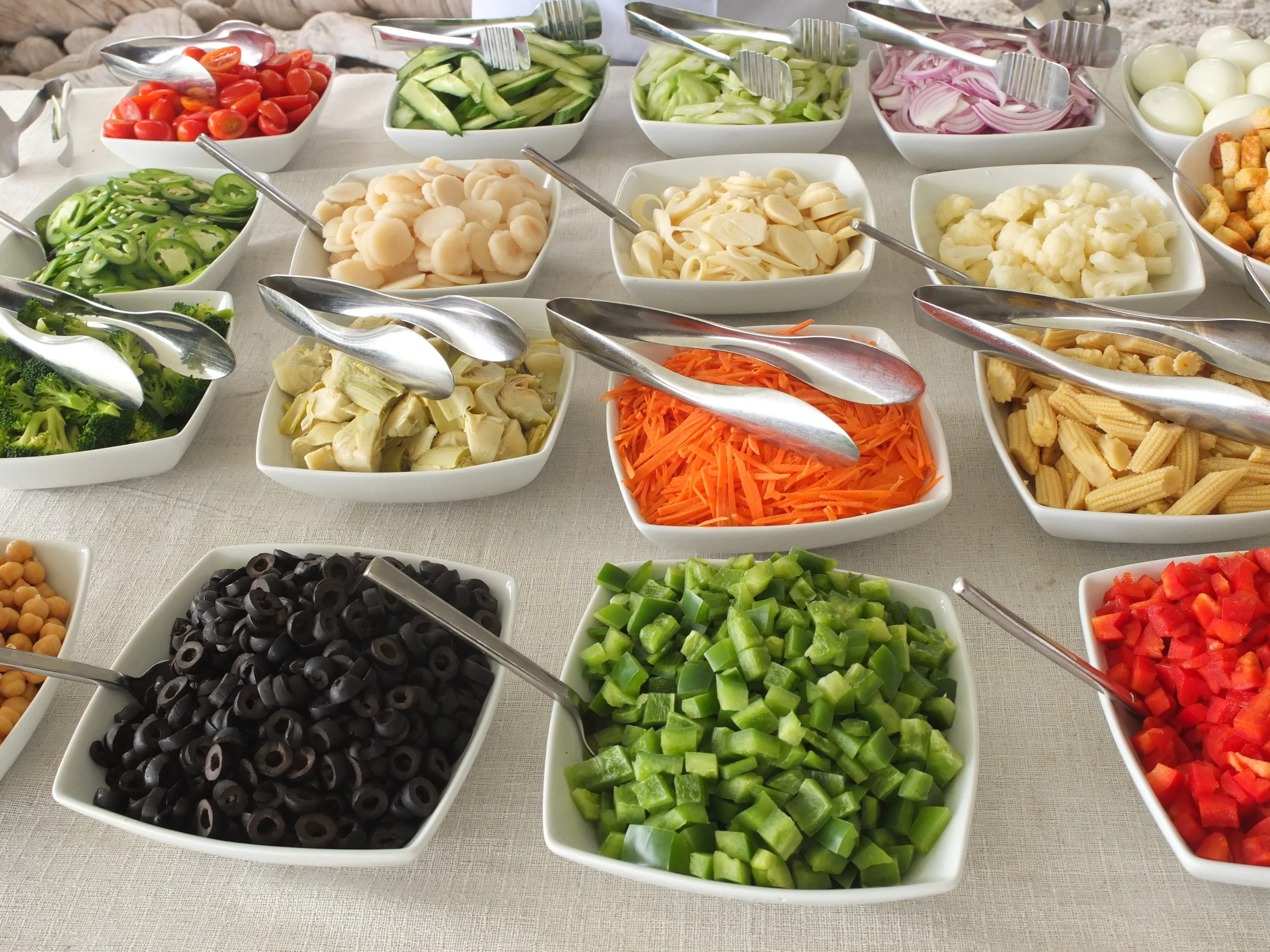 Our colorful fresh salad station: Guests select ingredients that are tossed with their favorite dressing by our chefs.