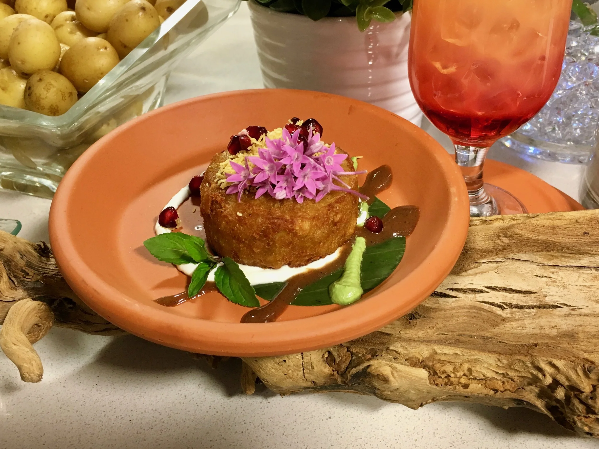 Tikki Chaat (Potato Curry Cake) served with Tamarind Sauce & Cool Mint Crème | Garnished with Crispy Lentil Threads and Pomegranate Seeds. Authentic Indian cusine is also increasingly popular and features many flavorful vegetarian recipes.