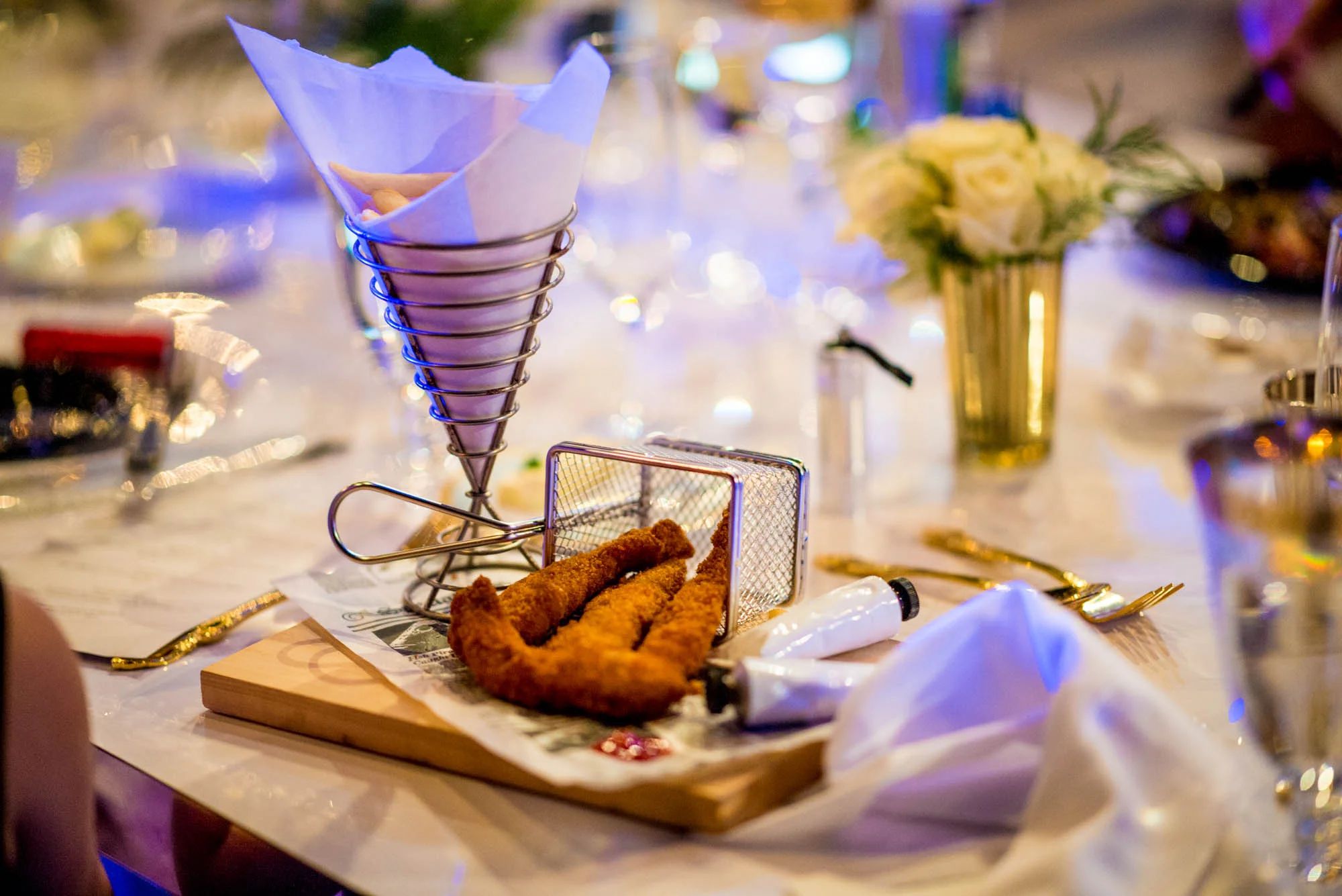 Children's Menu Favorite: Thierry Isambert's Chicken Tenders in a Fryer Basket with Metal Cone of French Fries and Tubes of Ketchup