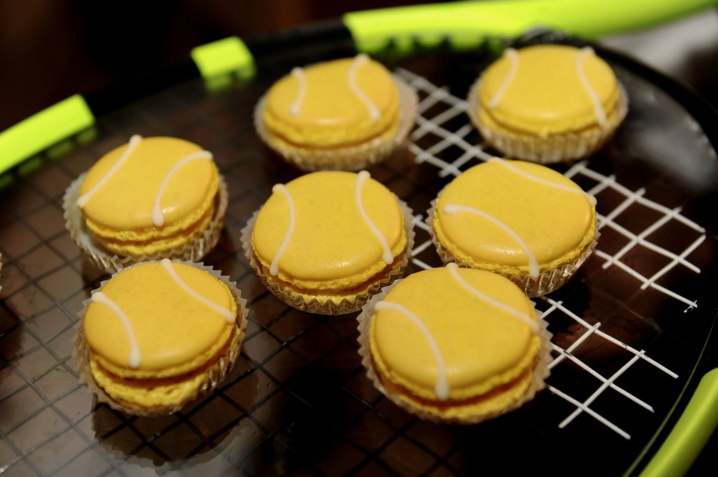 Lemon Macaroons with a tennis ball design