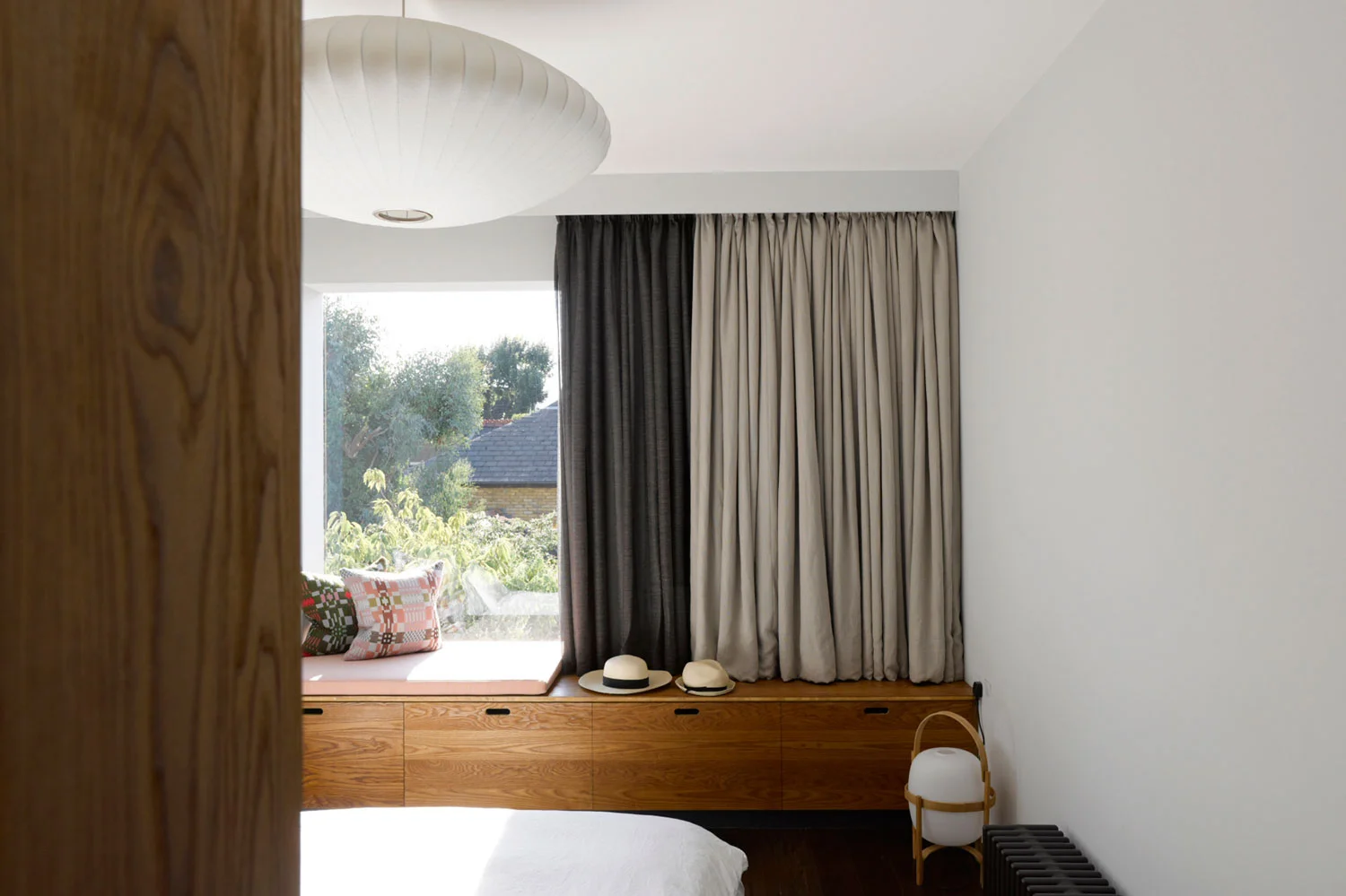 Our clients live in a 1930s house in Balham with their two young sons. One half of the couple had been raised in a modernist house in Belgium, surrounded by a collection of 20th Century Art while the other grew up in a mountainous region of Switzerland. Their sensibilities led them to give Liddicoat & Goldhill an open brief to adapt and expand their home, which had already been ‘opened up’ at ground floor level by previous architects. Liddicoat & Goldhill’s response addressed the entire house, and was based on analysis of the family’s living patterns, and by making only the most economical structural changes. The interior layout was fully remodelled, with the most invasive and dramatic work happening at ground floor level and in the cramped circulation space, where an efficient and sinuous new staircase was added. Selective re-instatement of previously-demolished walls reinstated the formal drawing room, facing the street, while a stepped extension to the rear created an open plan eating, cooking and informal relaxation area. The first floor was re-arranged to create a guest room, study and luxurious master suite with a meandering route from the sleeping area into the dressing and bathroom spaces. By extending at roof level, we created two new children bedrooms suites. These were designed to overlap the different functions of sleeping, entertaining and studying. The rooms have large structural glazed windows with integrated desks affording panoramic views across SW London. Aesthetically, the project has been conceived as a collage; a deliberate response to the vogue for monochromatic interiors. A rich mix of strongly-contrasting colours and textures creates a warmly tactile environment. In the kitchen, rough painted brickwork meets crisp plasterwork, black glass, stainless steel and strongly-grained wood. These provide the backdrop to carefully-chosen pieces of contemporary and mid-century Danish furniture, set against heated polished concrete floors. Key to the design was the combination of the clients’ existing furniture and art with new purchases and pieces designed specially for the project. Liddicoat & Goldhill design and make furniture and objects - certain pieces were created specifically for the Janssens-Kobler house; the architects worked with specialists to fabricate these items. Particular noteworthy elements include the laser-cut timber ‘Corral’ lamp hanging over the dining table is designed and made by Liddicoat & Goldhill.