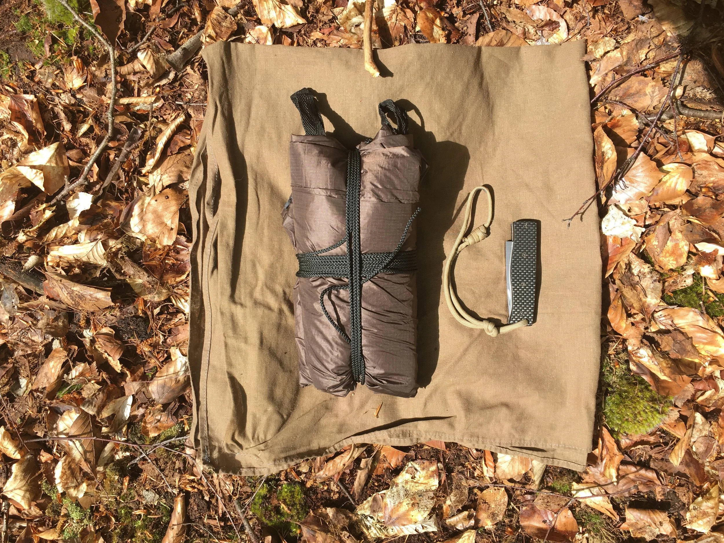 Here the tarp is packed up small, my pocket knife for scale.