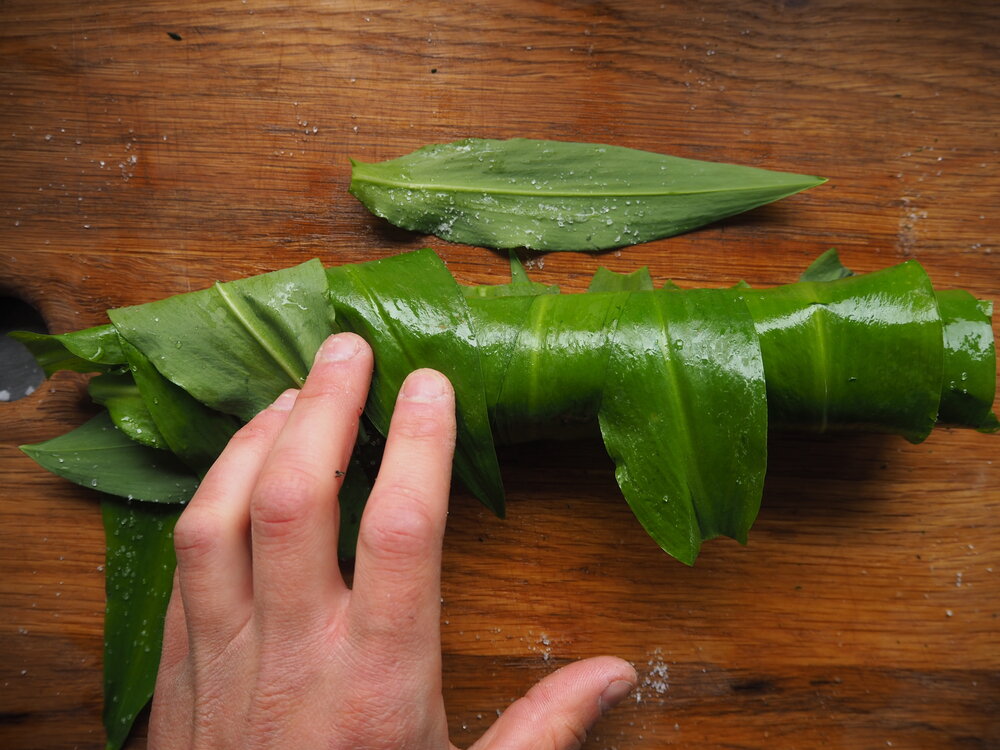 Roll the leaves and salt together