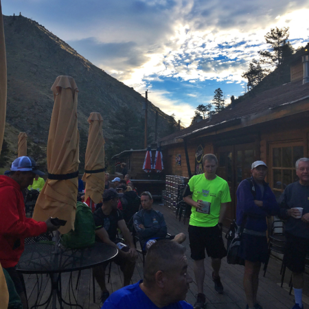 People hanging out on the deck on the back over looking the creek
