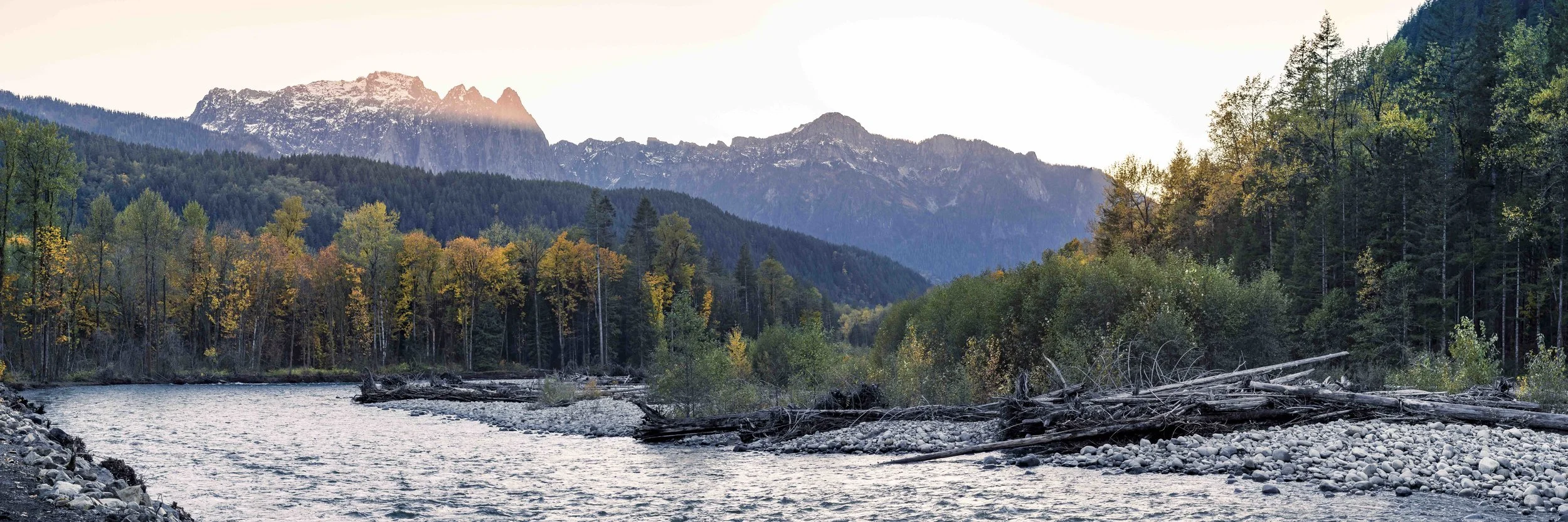 Pacific_Northwest_Fall_Season_Landscape_of_Mountain_River_and_Autumn_Color_Trees_.jpg