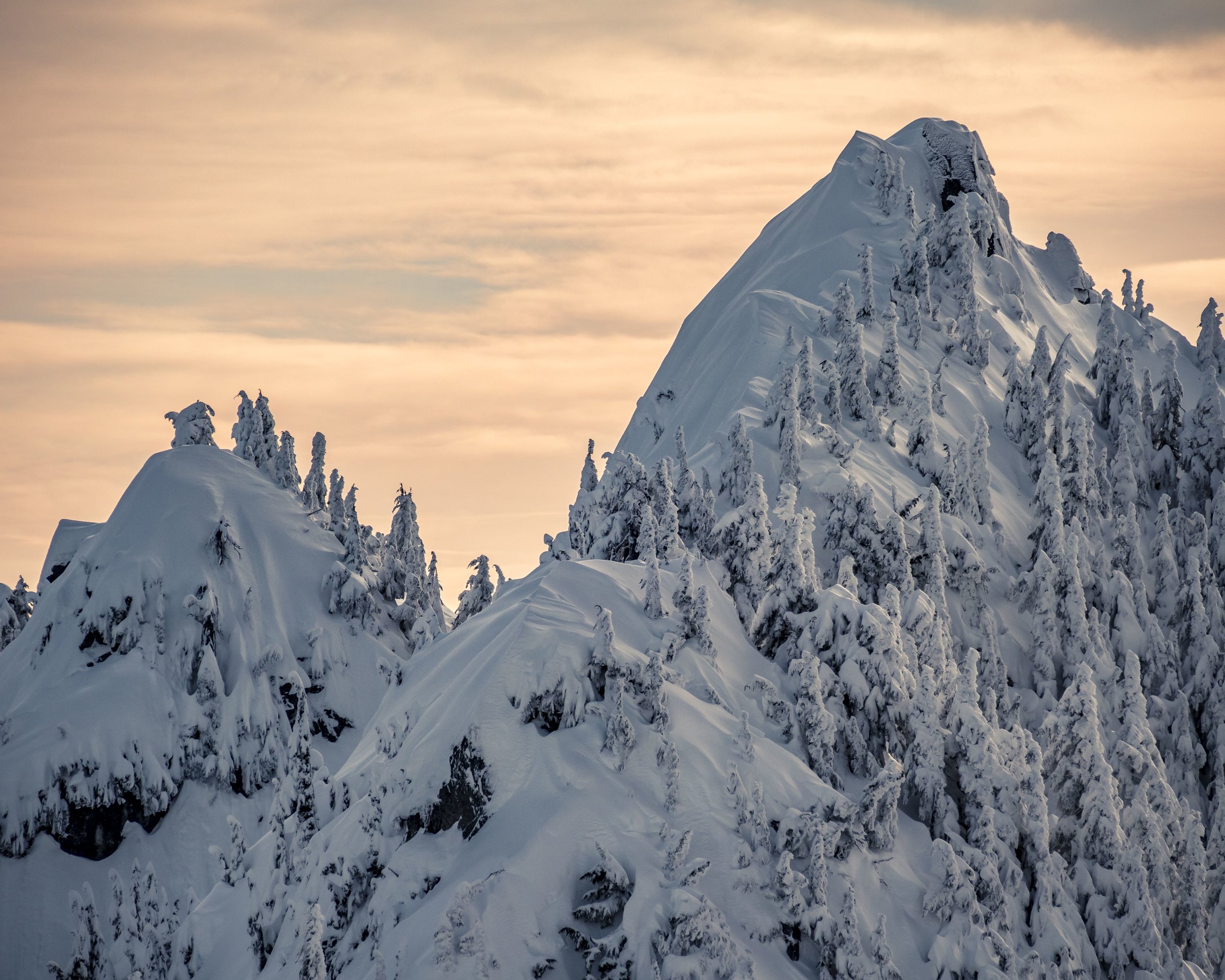Vibrant_Winter_Sunset_on_Snowy_Fresh_Powder_Mountain_Peaks.jpg