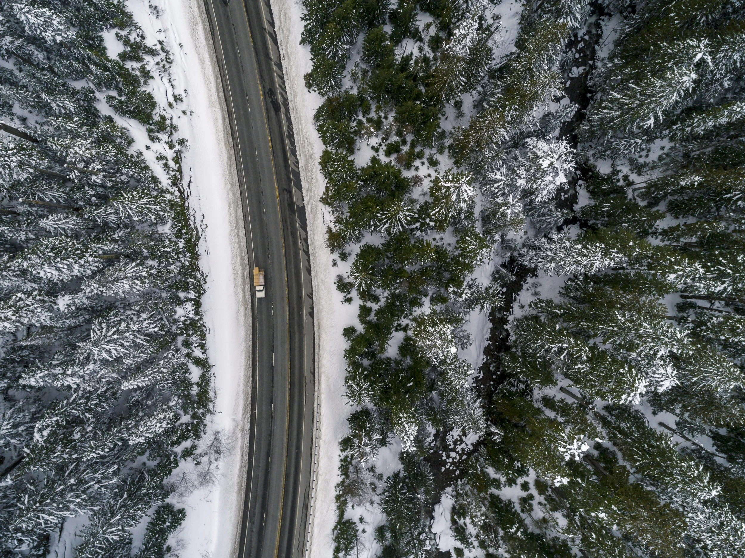 Pacific_Northwest_Overhead_Snowy_Highway_Aerial.jpg
