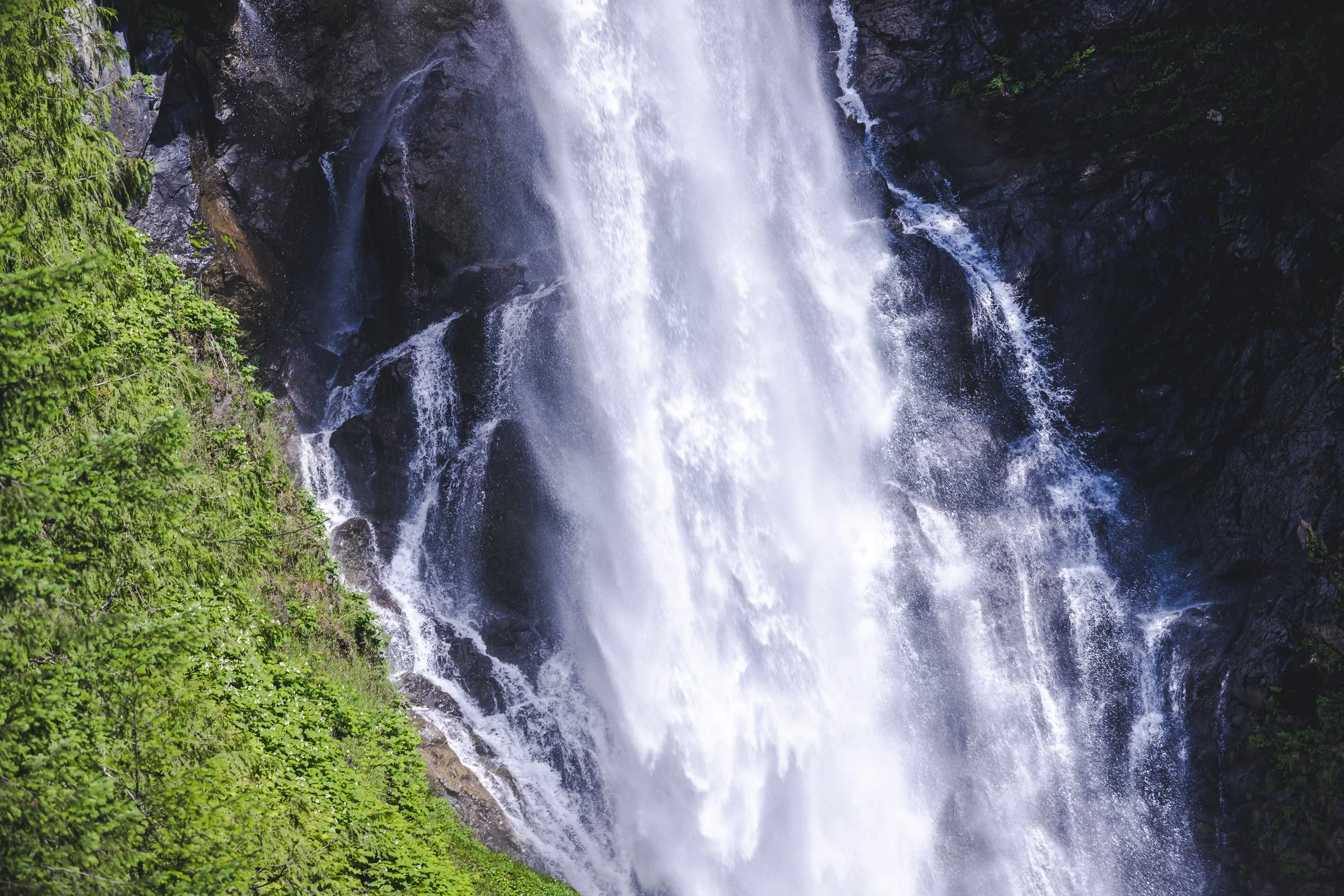 Misty_Waterfall_Spray_on_Rocks_Close_Up.jpg