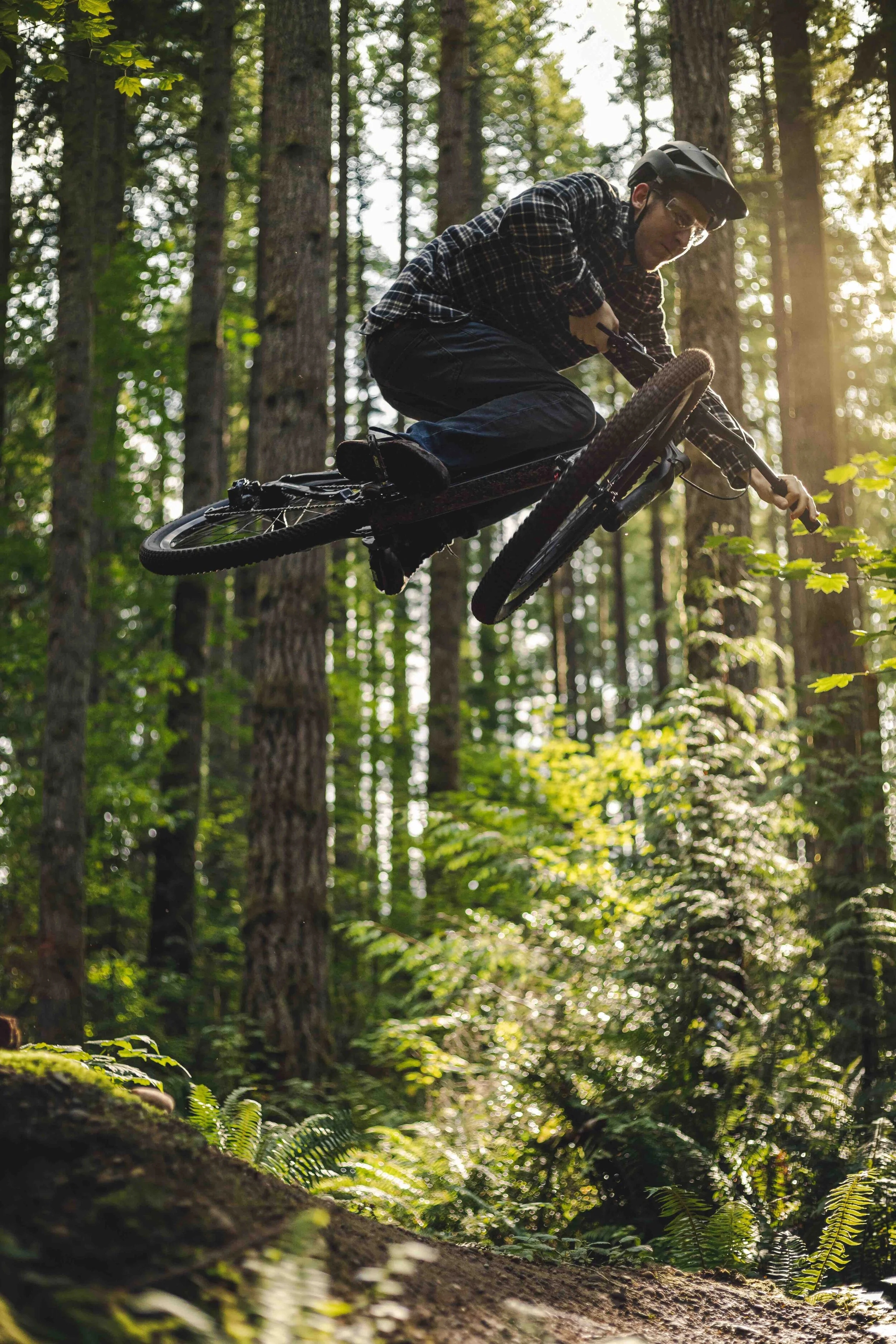 Amazing_Mountain_Bike_Jump_Trick_in_Forest_with_Golden_Hour_Lighting.jpeg