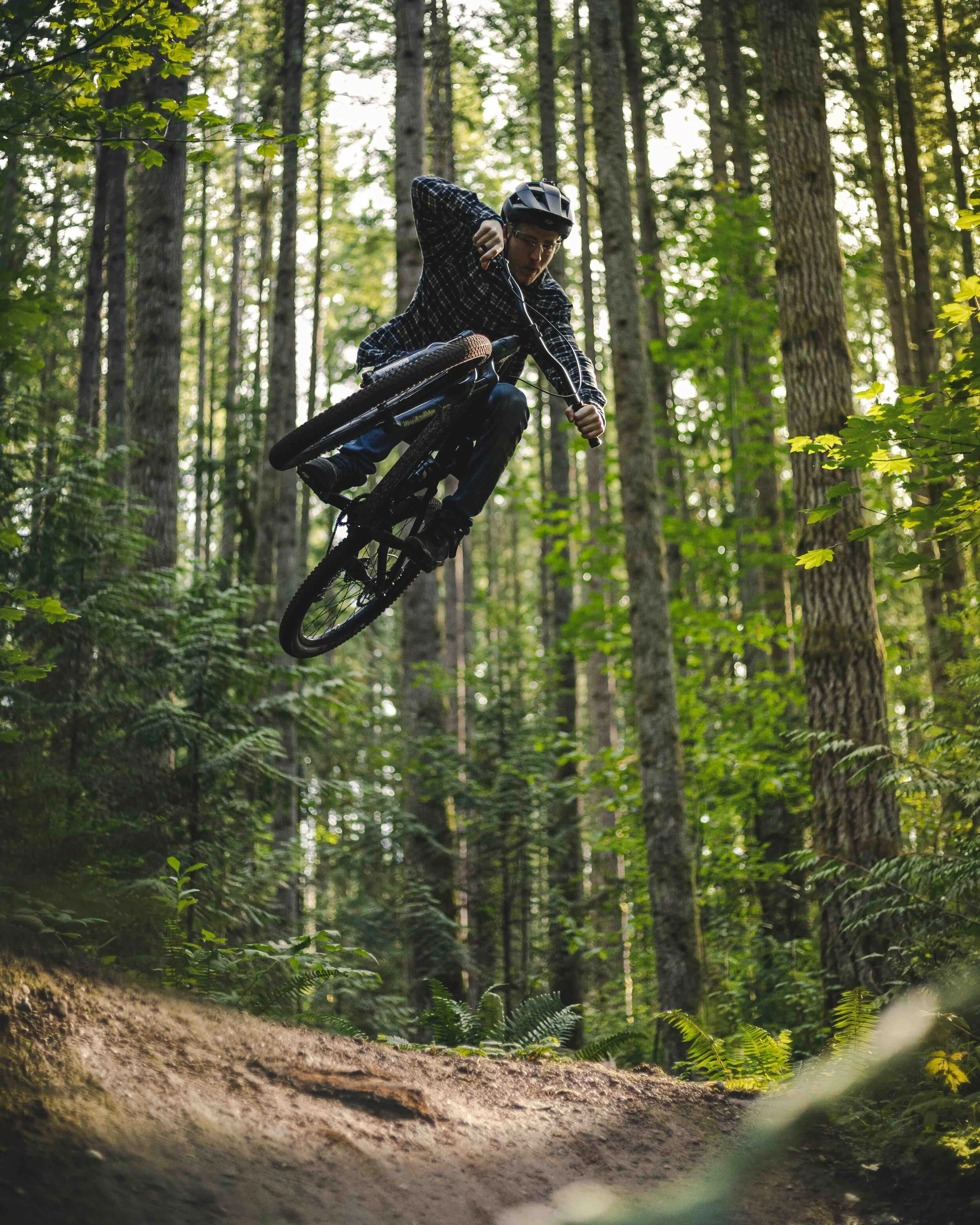 Stylish_Mountain_Bike_Jump_Trick_Catching_Air_in_Forest.jpeg