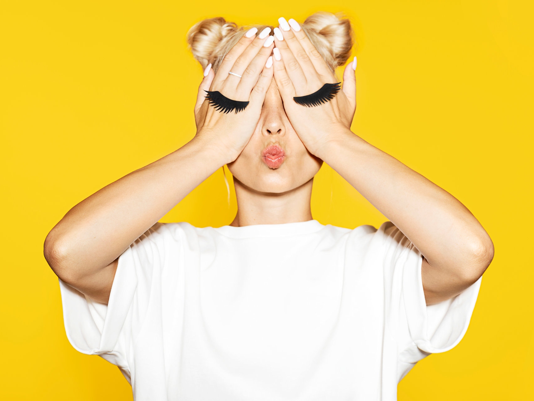 shutterstock_1164111343 Yellow background, eyes covered.jpg