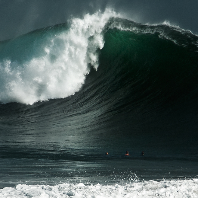 The underwater topography along Balboa Peninsula and the presence of the manmade "West Jetty" combine to create a unique swell at The Wedge, where waves can reach 20+ feet at times. Storms and hurricanes from as far away as New Zealand can affect these swells along California's coast. Thousands will turn up to watch on a day like the one pictured above. (photo: Craig Berry)