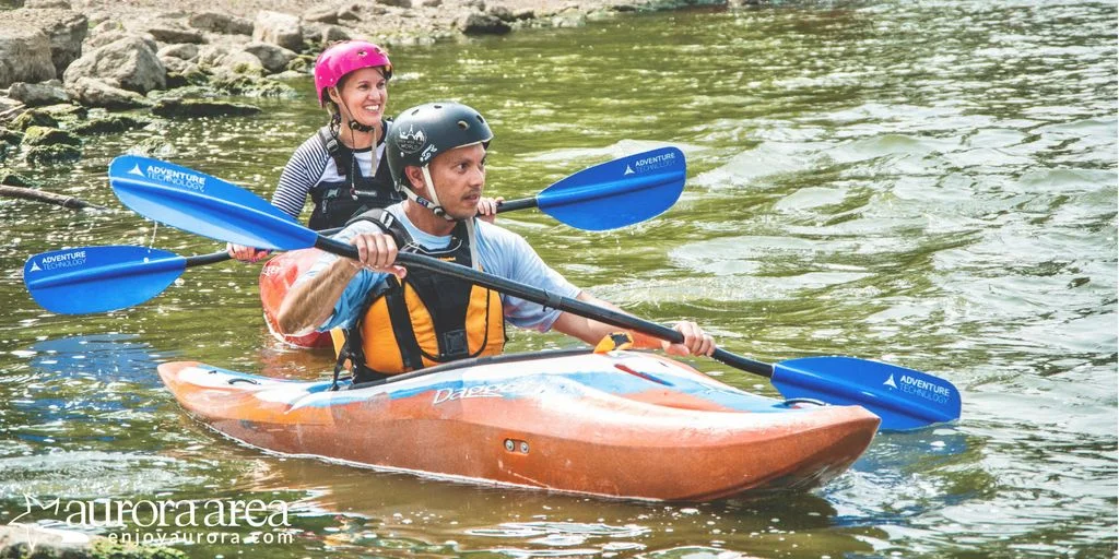 Judging from our smiles, our first whitewater kayaking lesson was a huge success! (Photo: James Cardis, Aurora Area CVB)