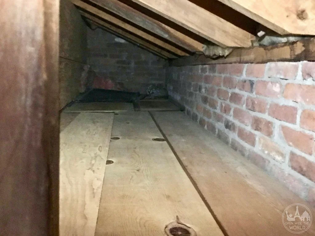 A few feet wide, a few feet tall, and the length of a bedroom, this hiding space's opening could quickly and easily be hidden behind a piece of furniture.