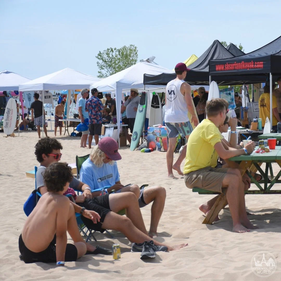 The Great Lakes Surf Festival answers the question “Can you surf on the Great Lakes?” Spend a day at this annual watersport gathering on Lake Michigan, near Muskegon, Michigan, and fall in love with surfing, SUP and more on the Third Coast! #surfing #openwidetheworld