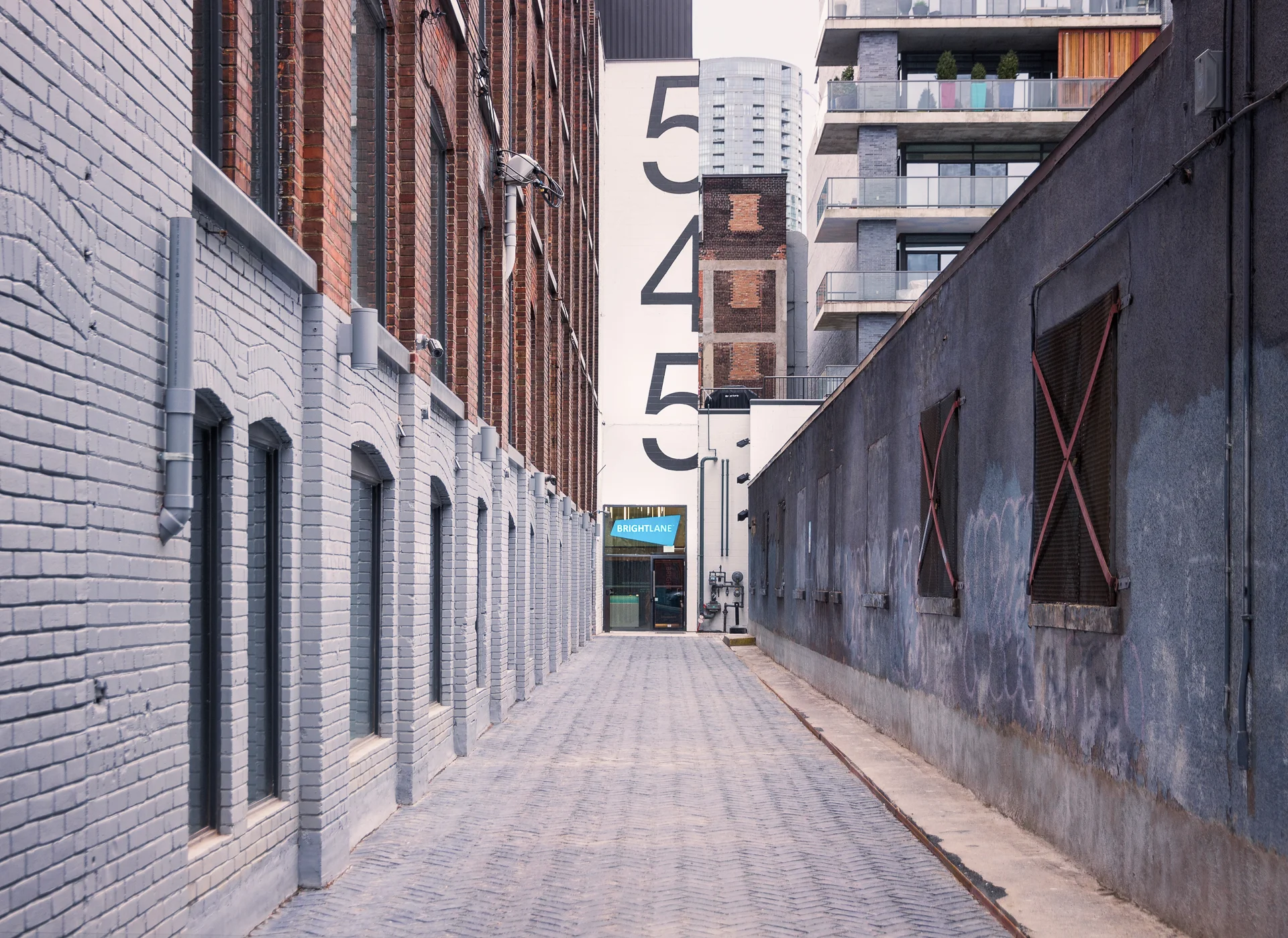 The escape game uses the same door as Brightlane Inc. Look for a long alleyway with a huge 545 on the back wall, walk to the end of it, call the number and we'll receive you at the door.