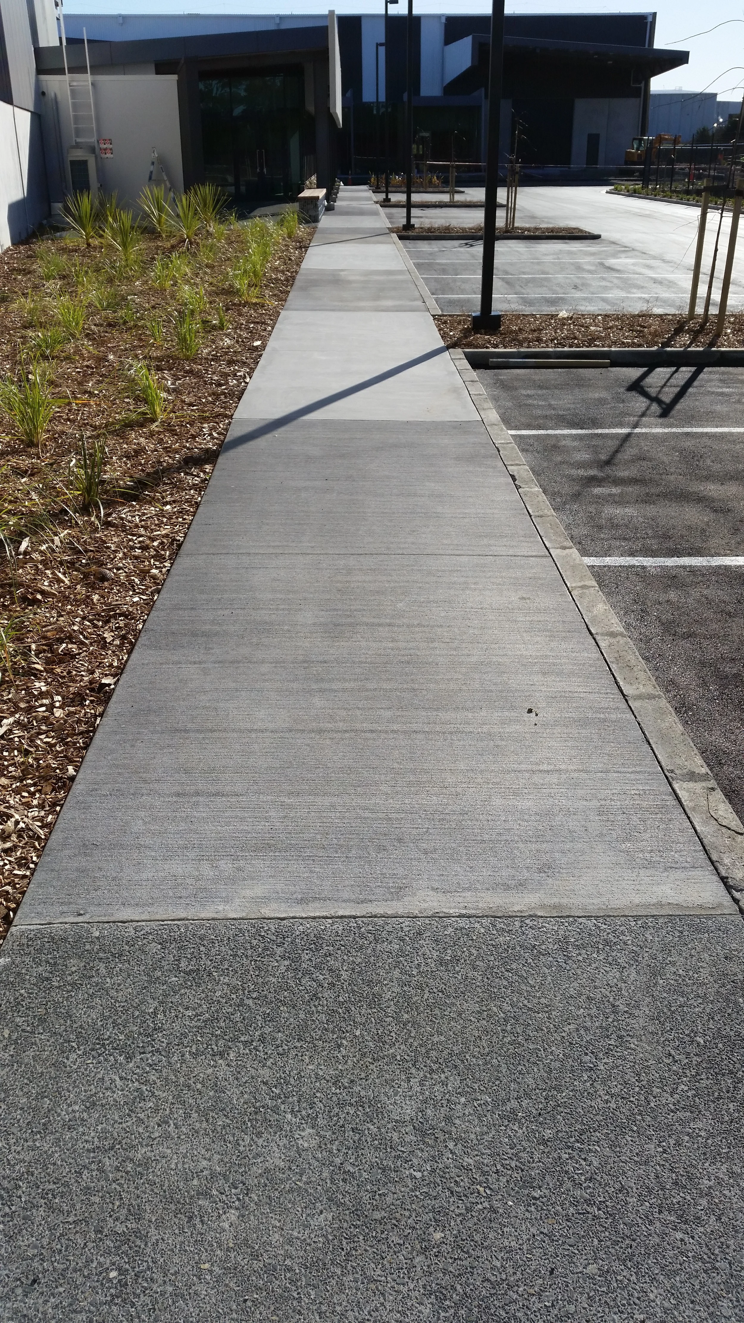  Path with exposed aggregate finish, broom finish and honed finish 