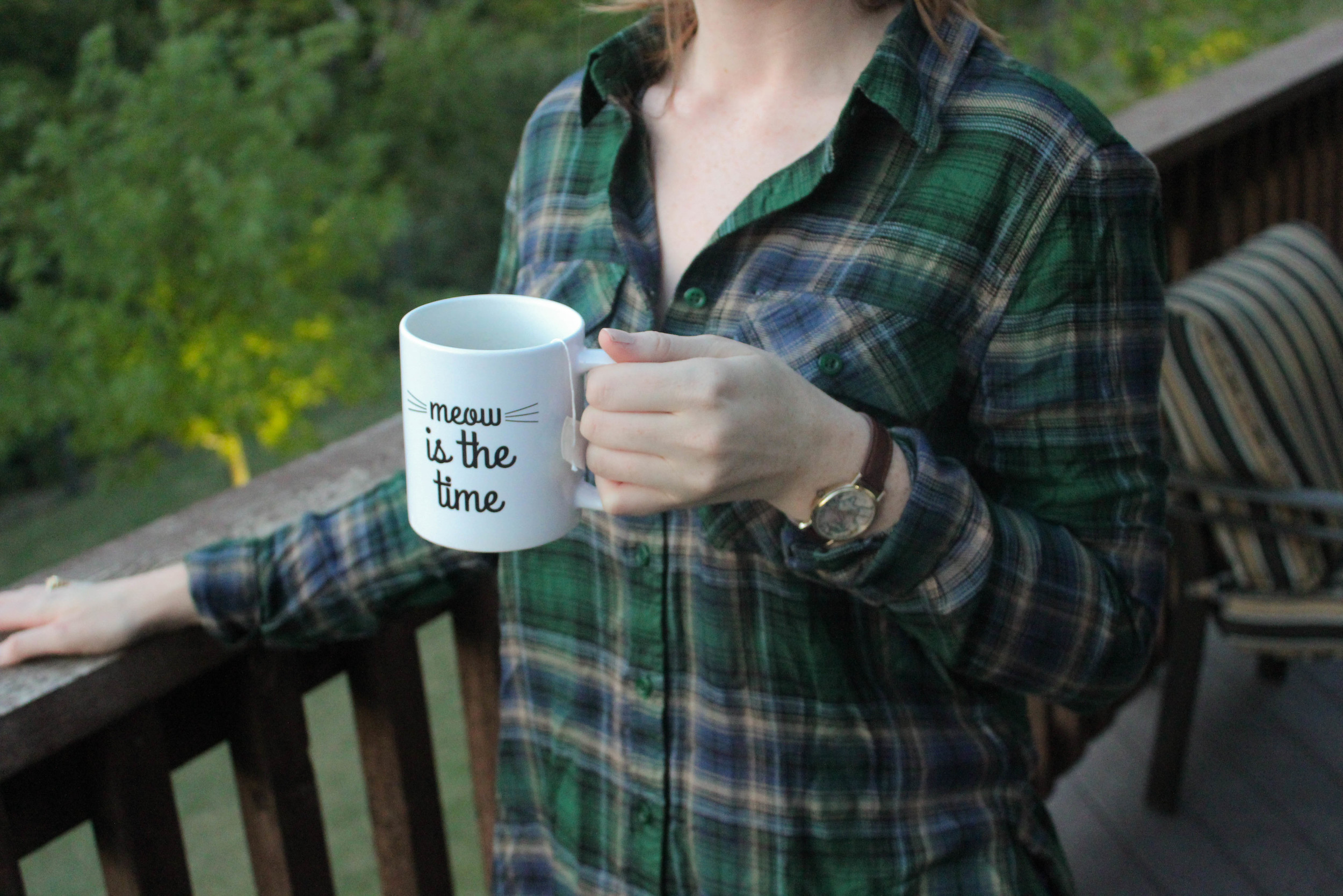 green plaid flannel, tea mug, map watch