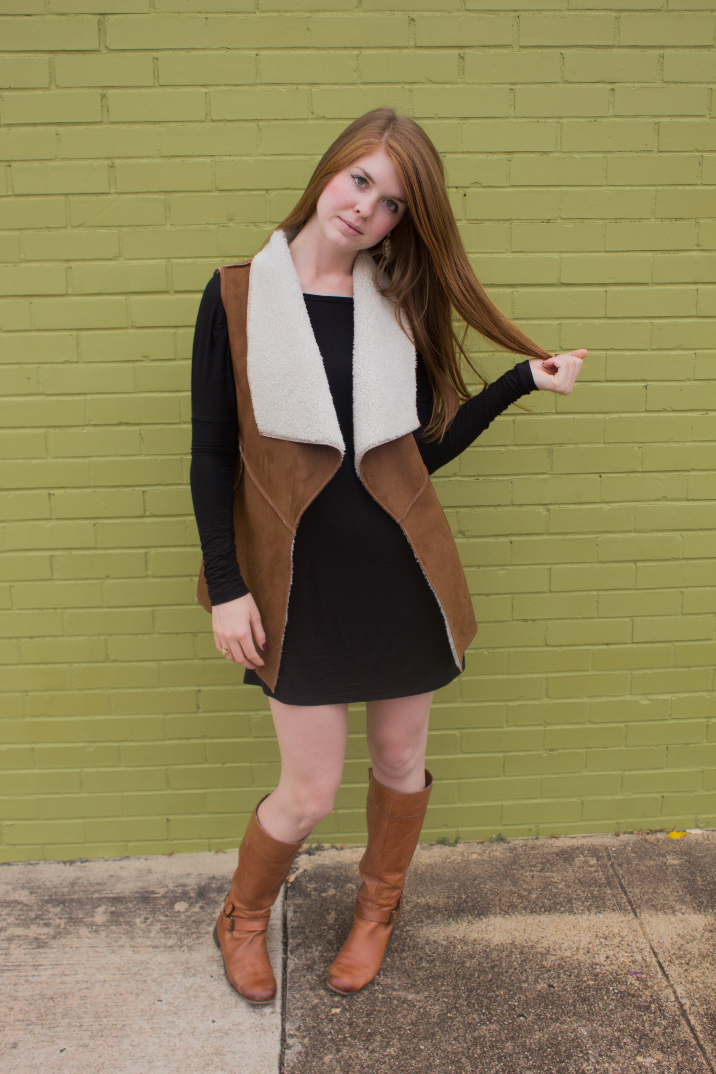 shearling vest, riding boots, piko tunic