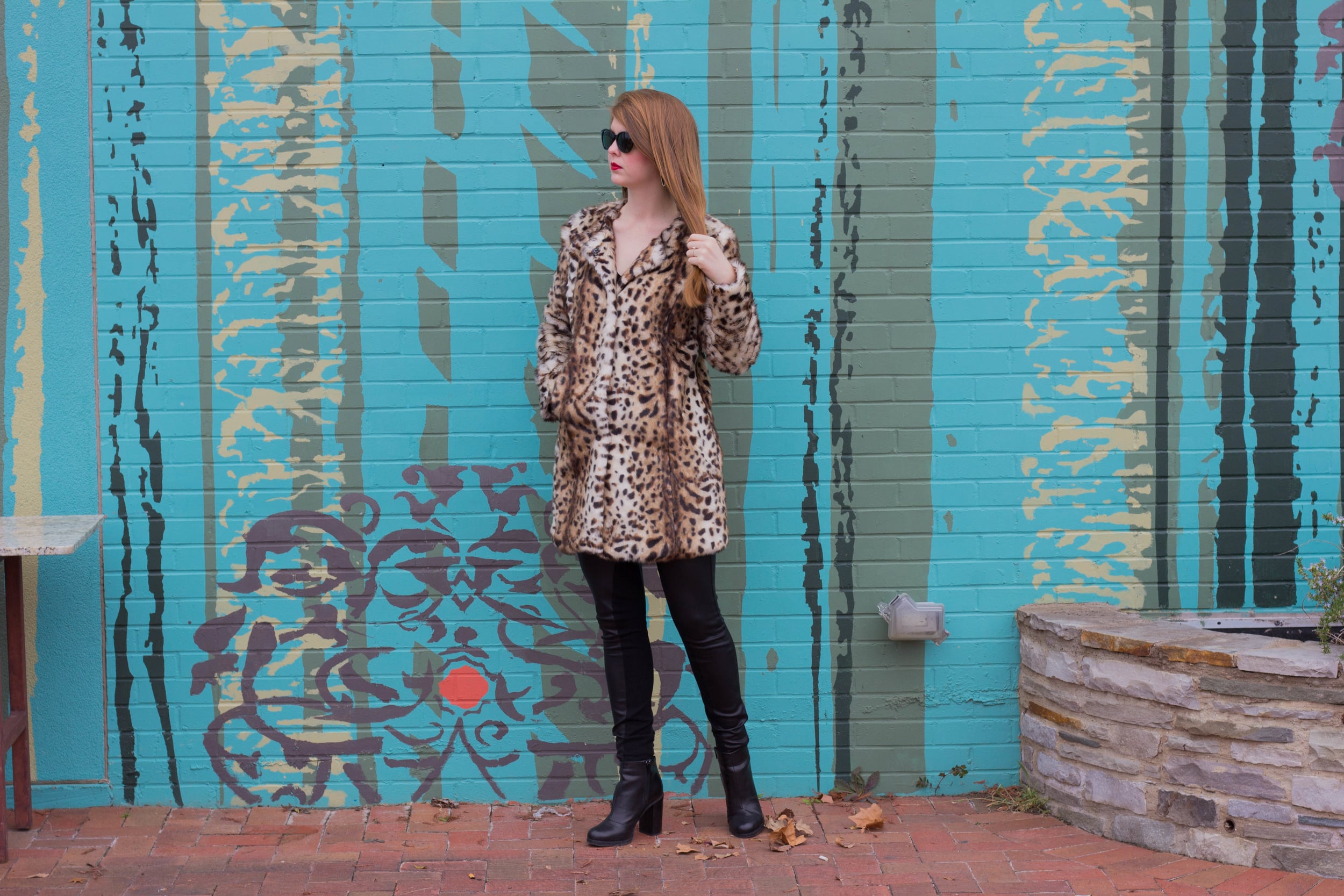leopard coat, leather joggers, black raybans, red lip