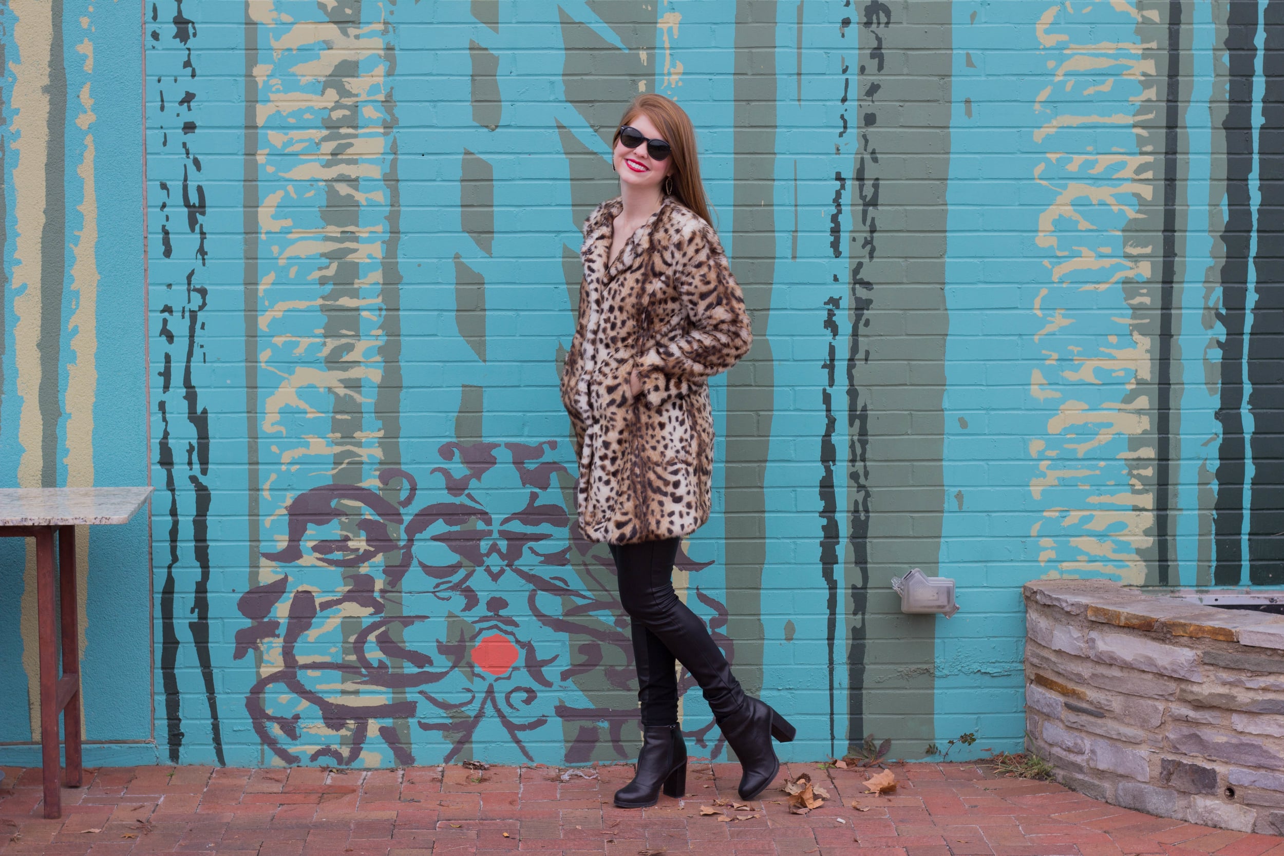 leopard coat, leather joggers, black raybans, red lip