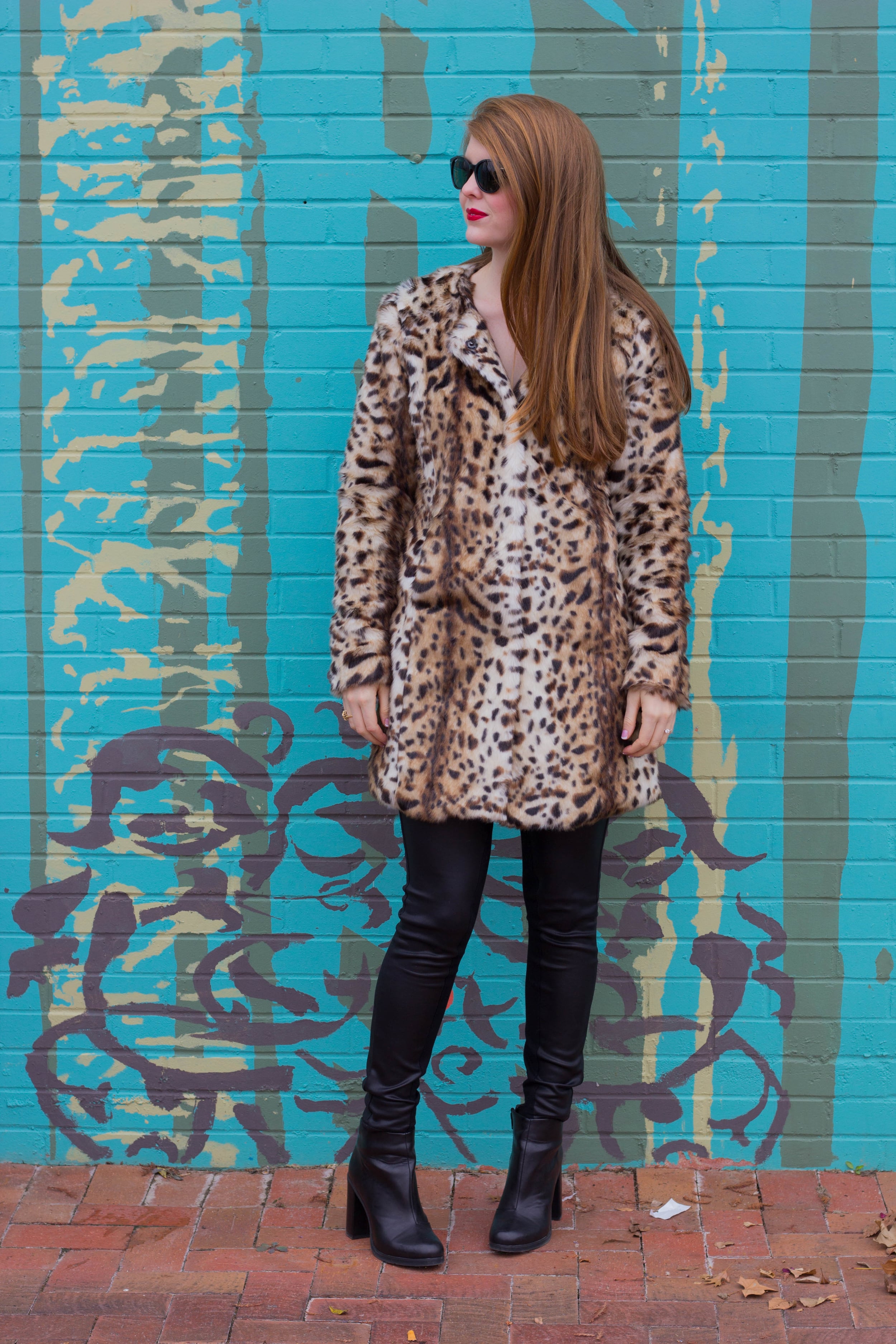 leopard coat, leather joggers, black raybans, red lip