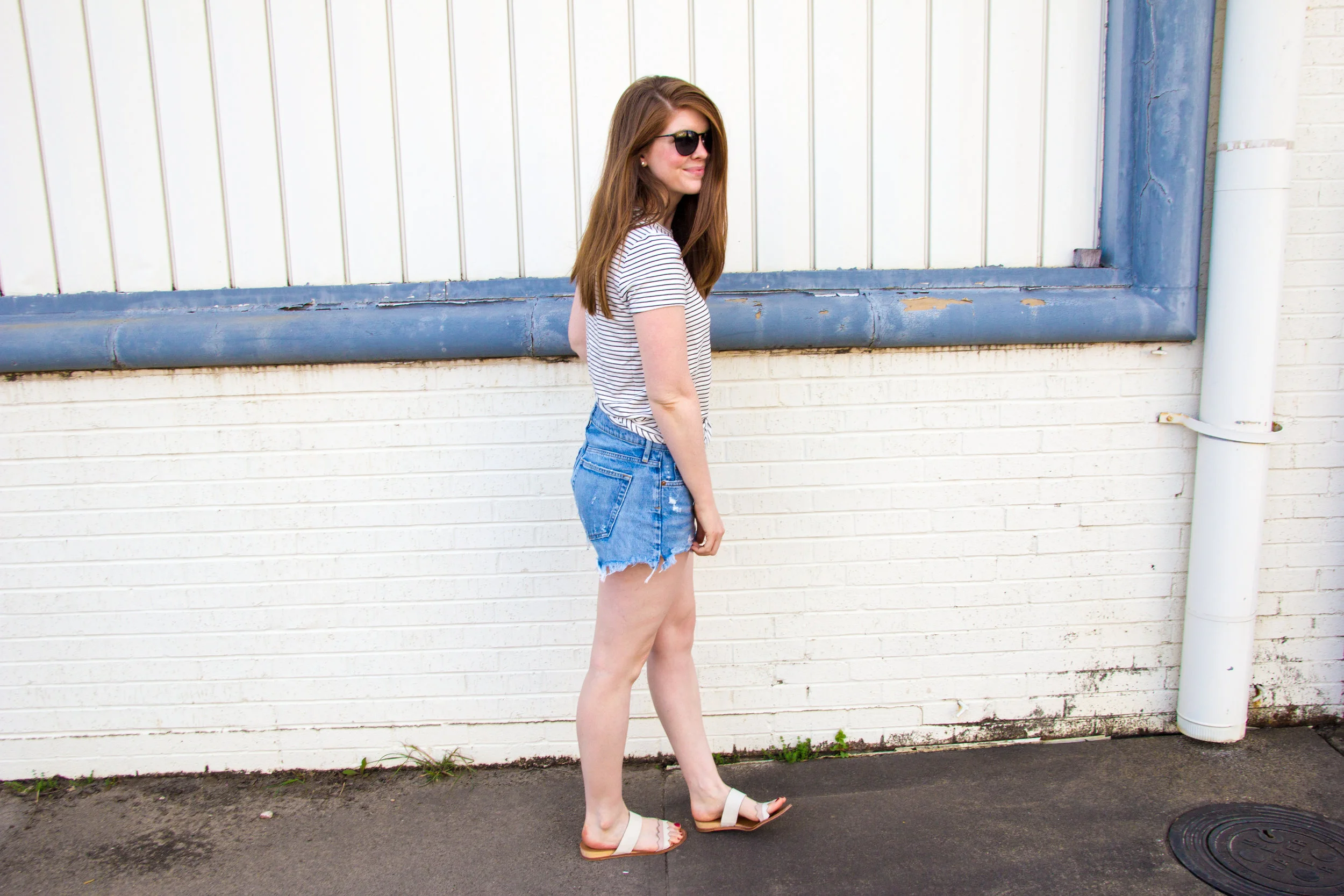 longer denim shorts, agolde parker denim shorts, daily ritual supersoft terry tee, ray-ban erik sunglasses, white slides sandals, 31 bits together bracelet, thirt one bits, denim shorts that are longer than one teaspoon, cut-off jean shorts that are…