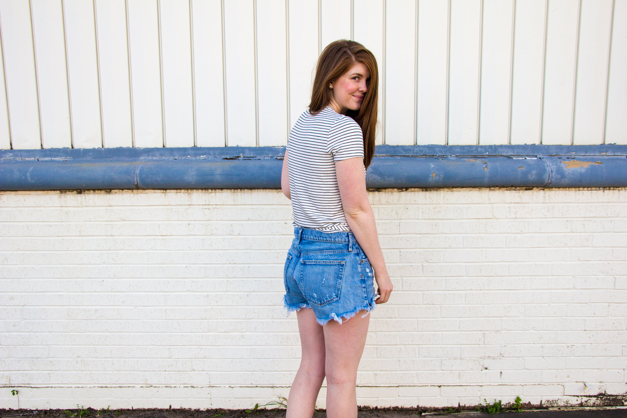 longer denim shorts, agolde parker denim shorts, daily ritual supersoft terry tee, ray-ban erik sunglasses, white slides sandals, 31 bits together bracelet, thirt one bits, denim shorts that are longer than one teaspoon, cut-off jean shorts that are…